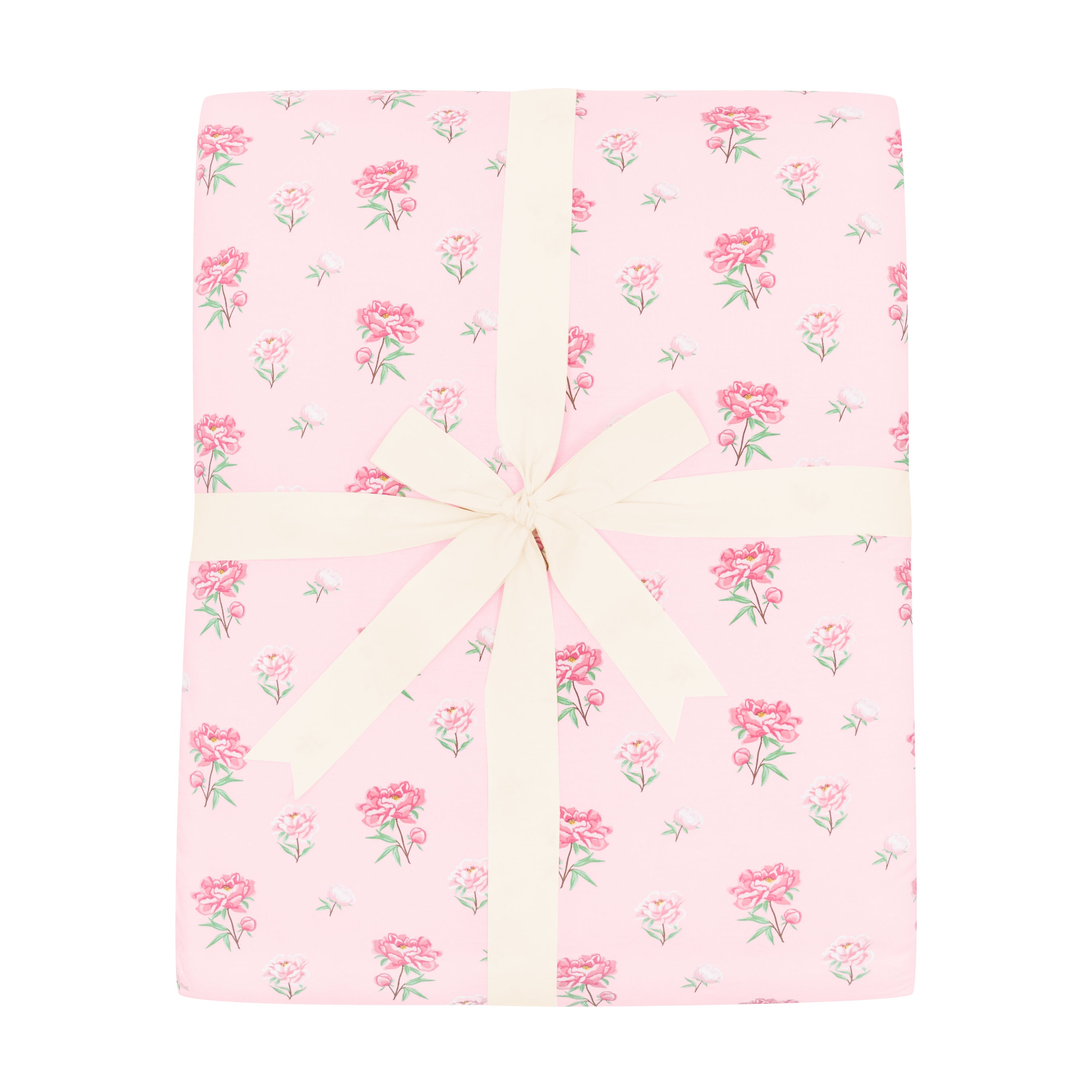 Kyte Baby Adult Quilted Blanket in Sakura Peony 2.5 shown wrapped in a bow