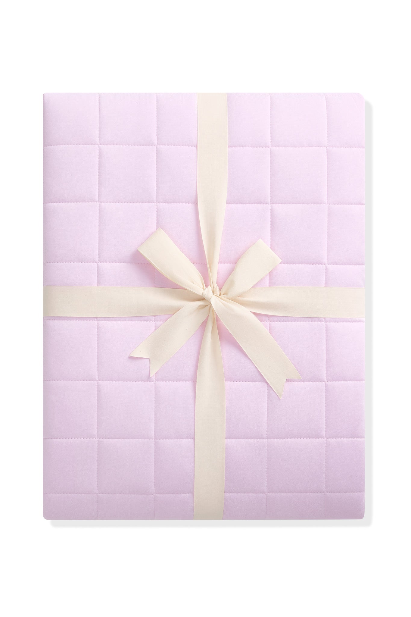 Quilted purple blanket with a cream ribbon on a white background