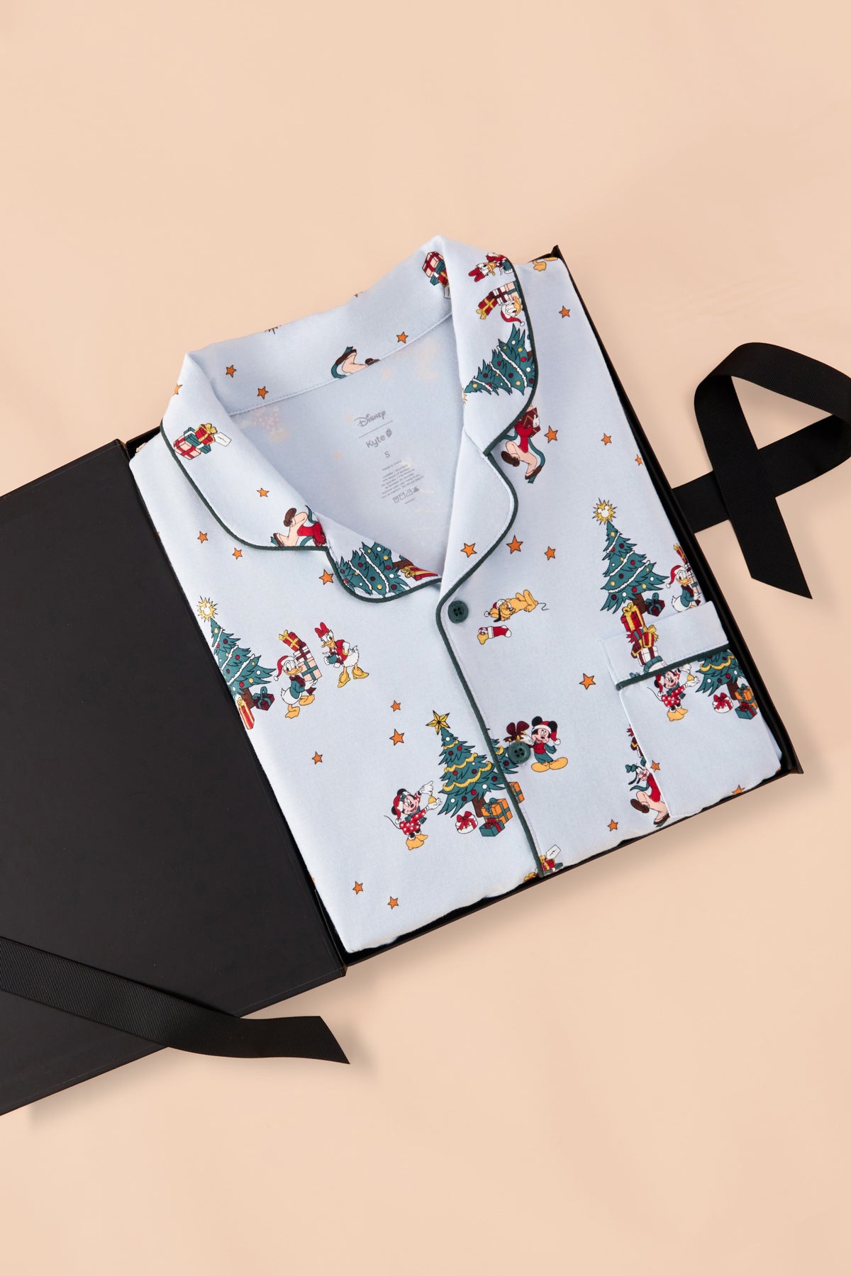Men's Long Sleeve Pajama Set in Mickey & Friends Christmas print packed in a black box on a beige background