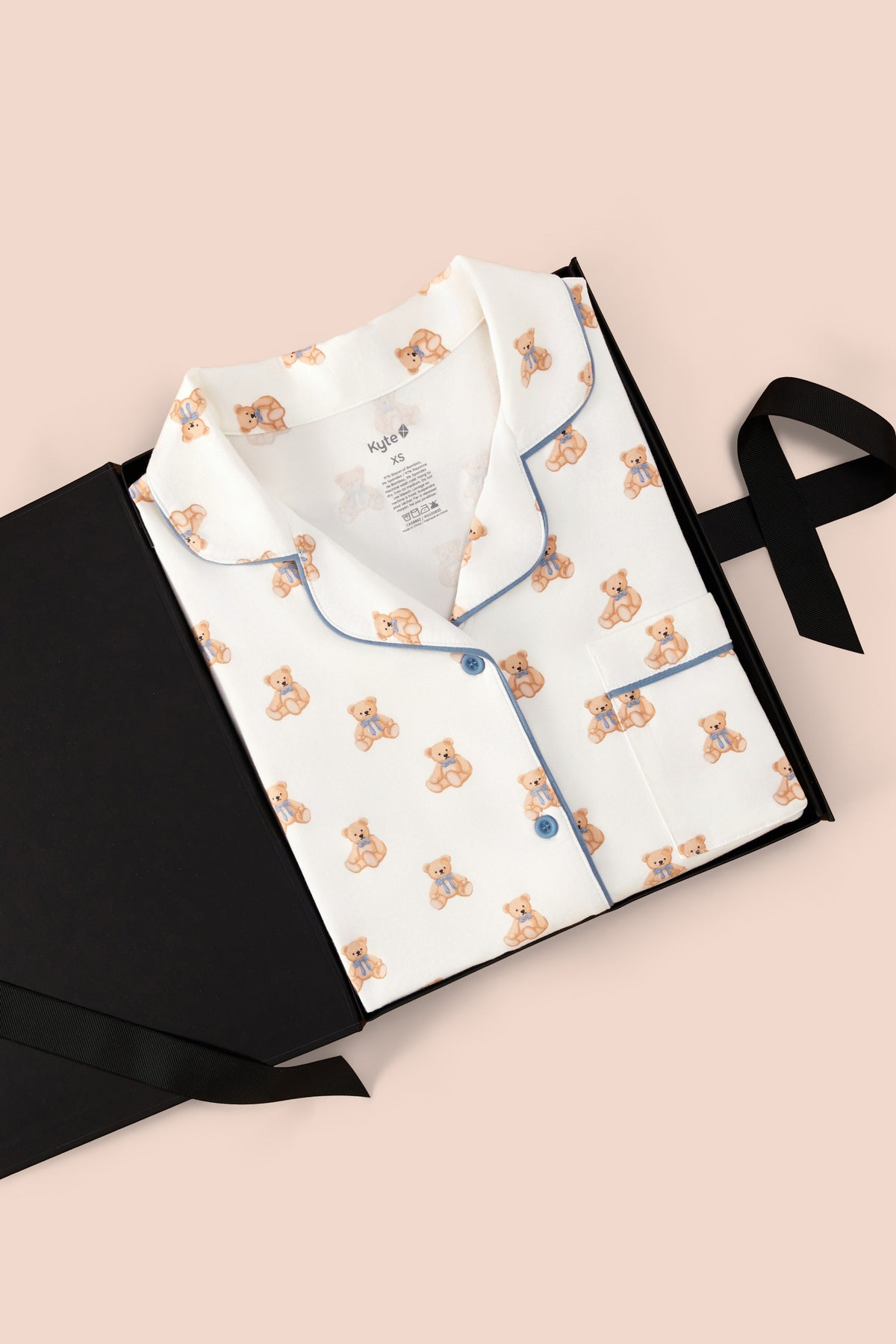Women’s Short Sleeve Pajama Set in Teddy Bear print packed in a box on a beige background