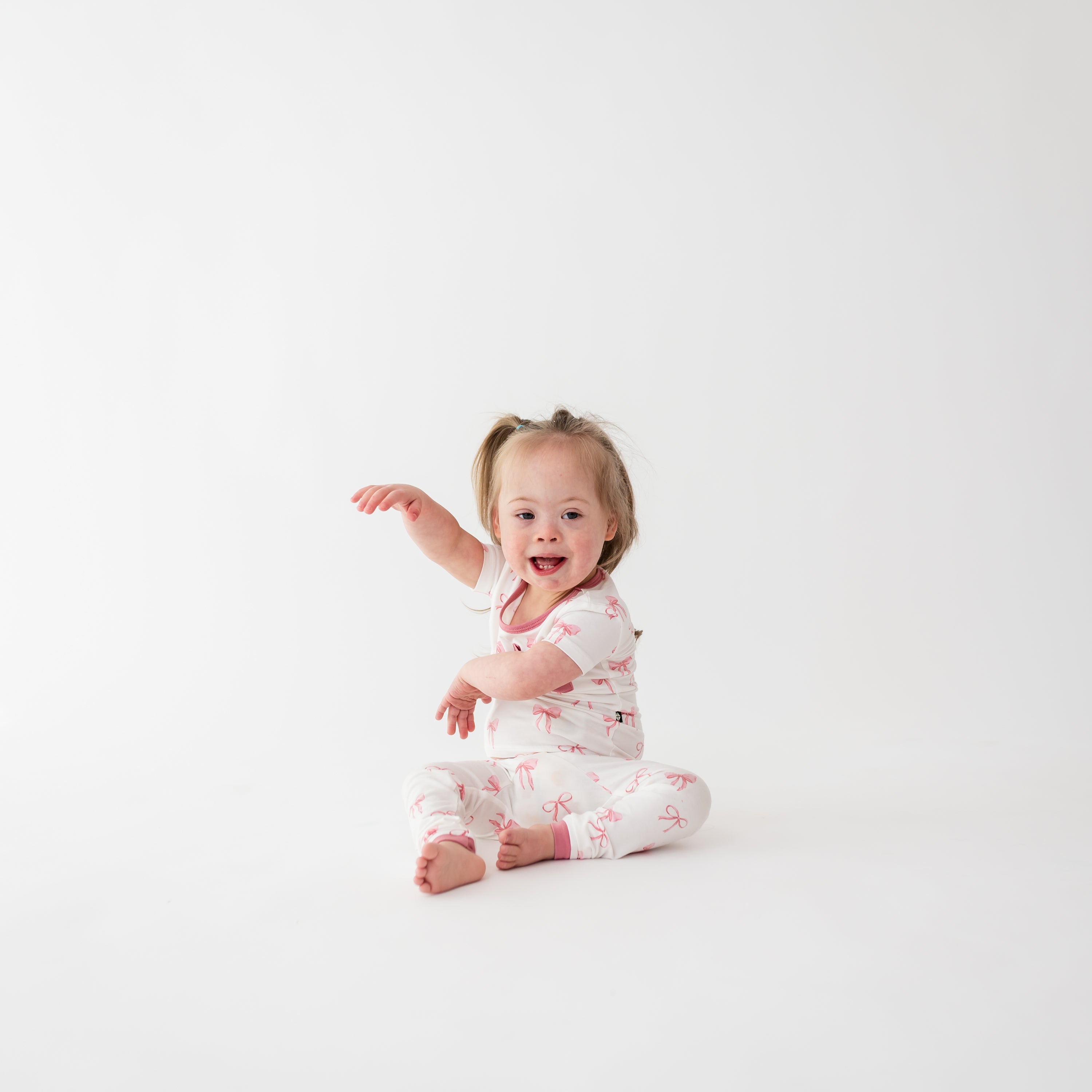 Toddler wearing Short Sleeve with Pants Pink Pajamas in Bow