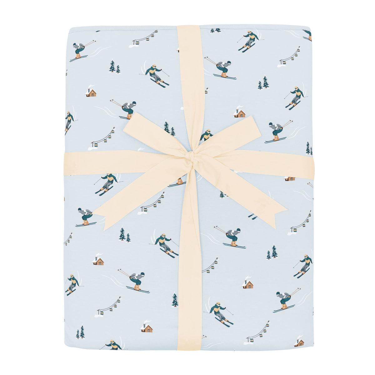 Youth Blanket in Ski 2.5 shown in its packaging tied in a linen bow