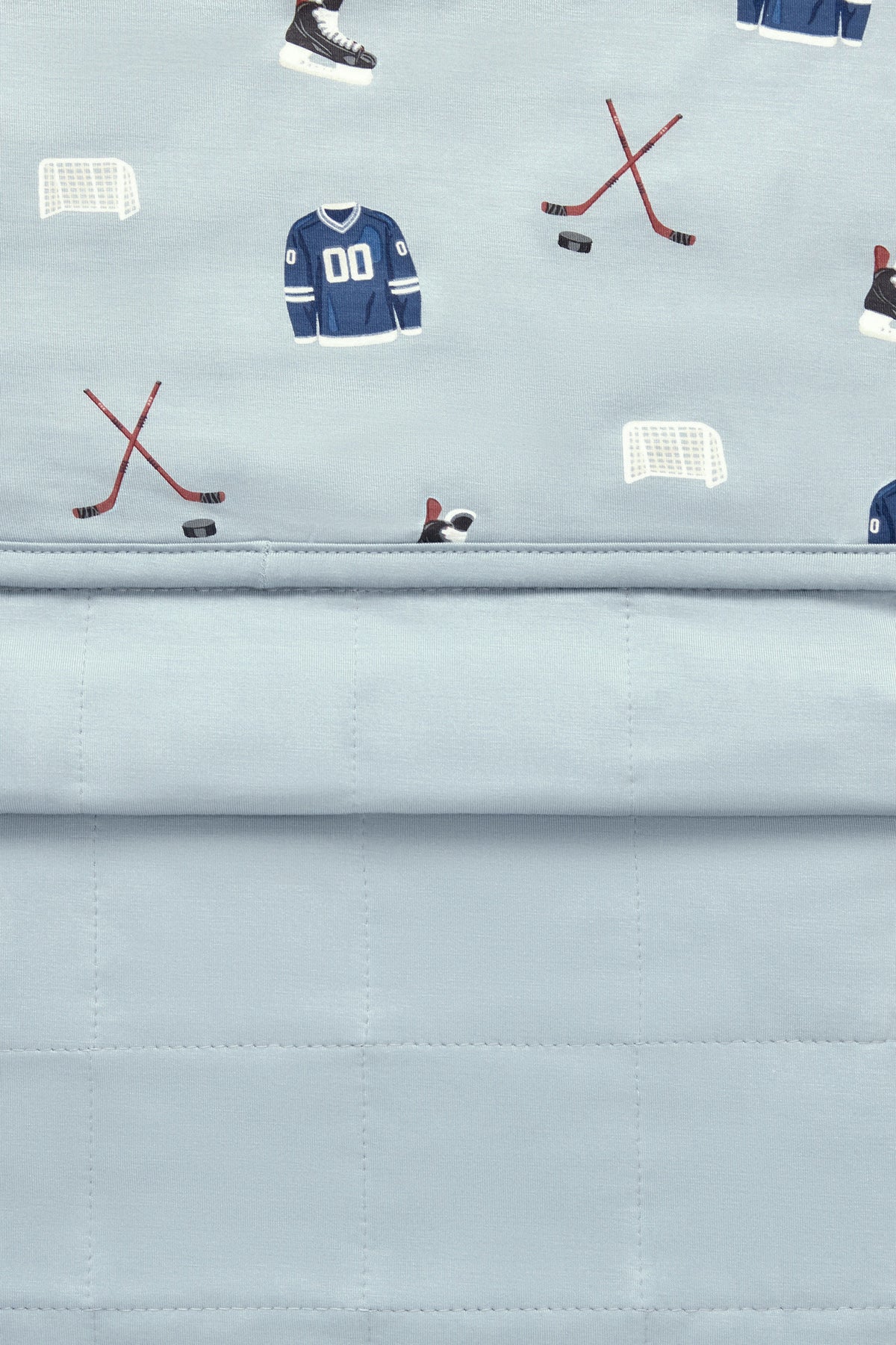 Front and back of Youth Blanket in Vintage Hockey 2.5 print