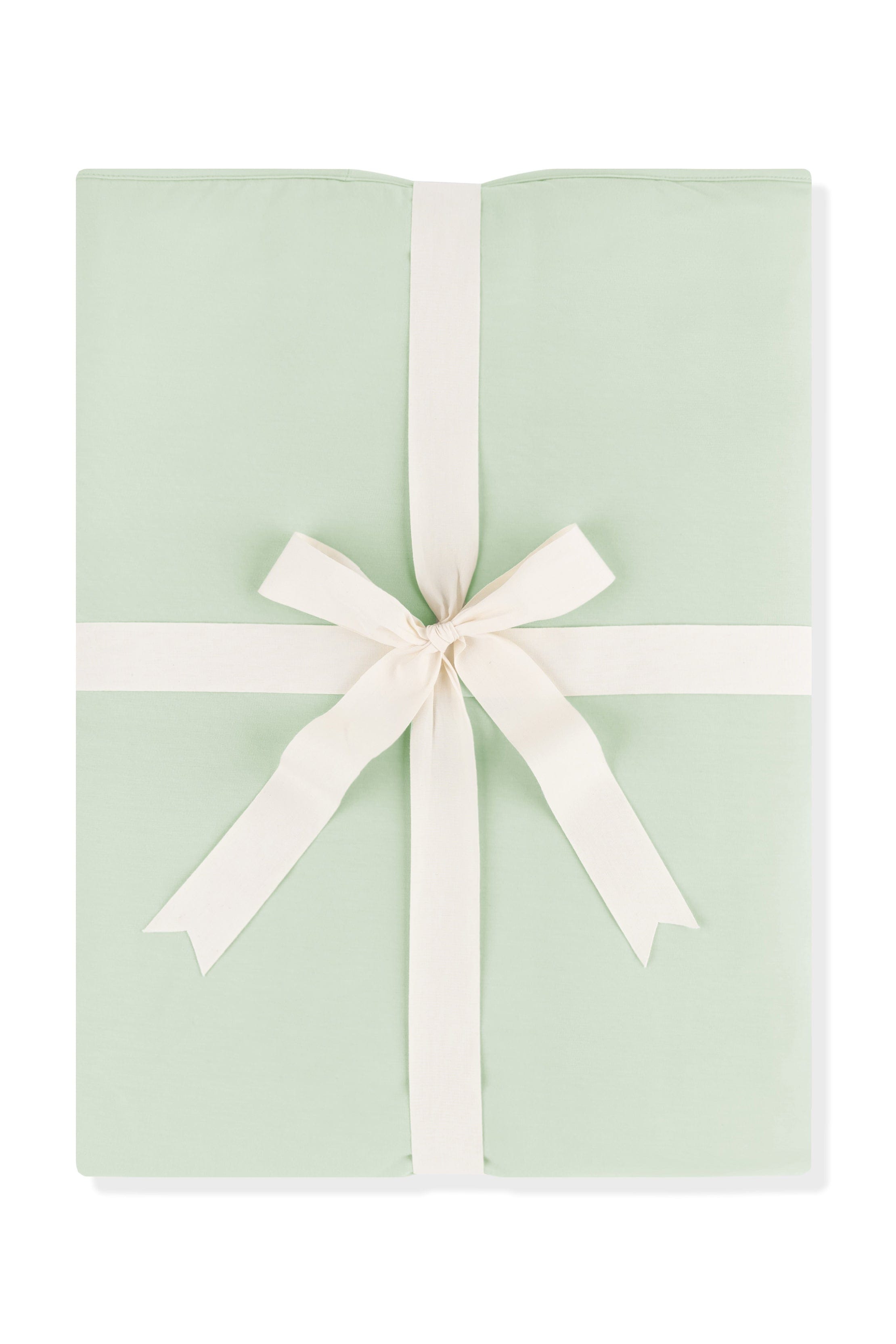 Youth Blanket in Basil 1.0 shown wrapped in its packaging tied with a linen bow