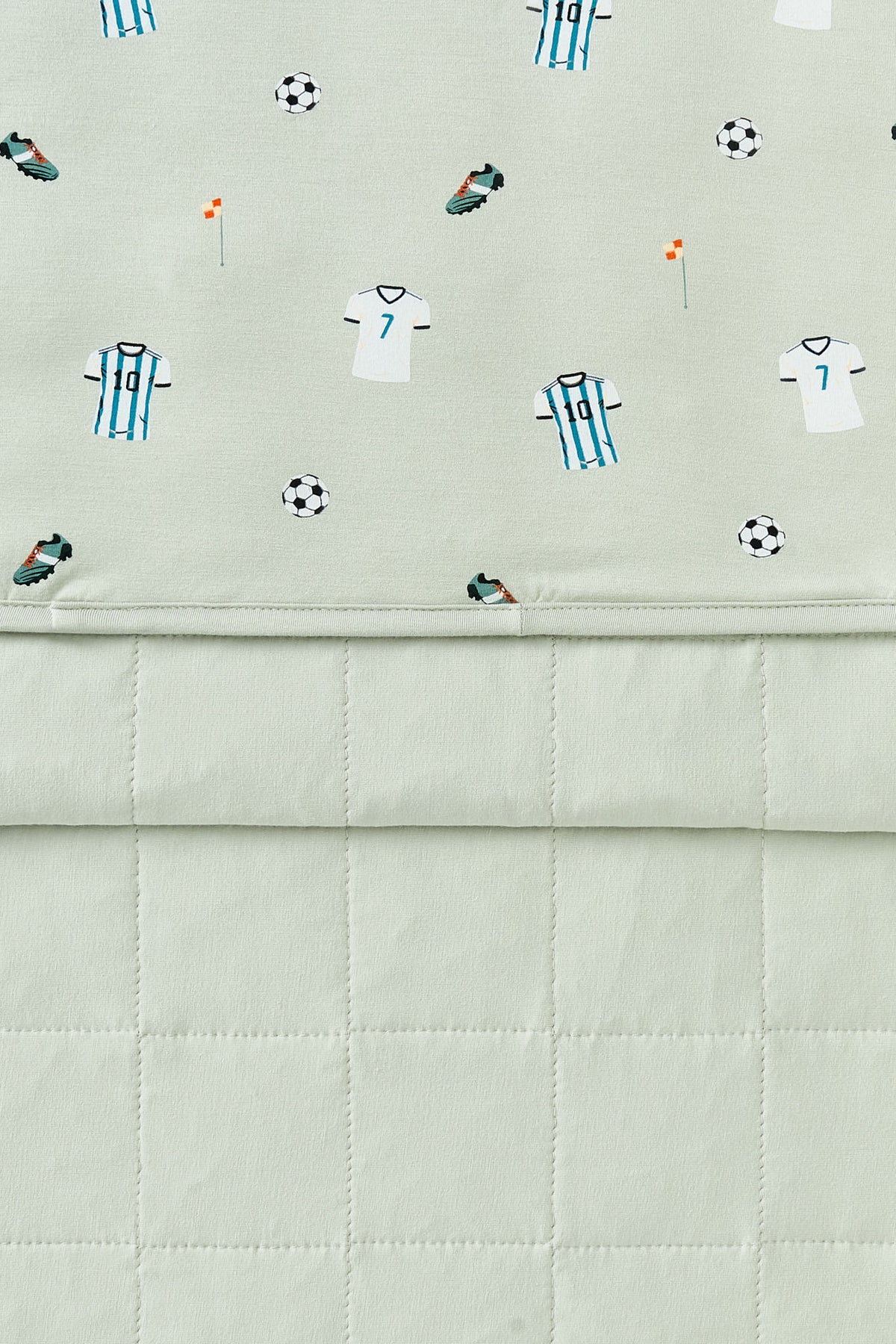 Front and back side of Youth Blanket in Soccer print