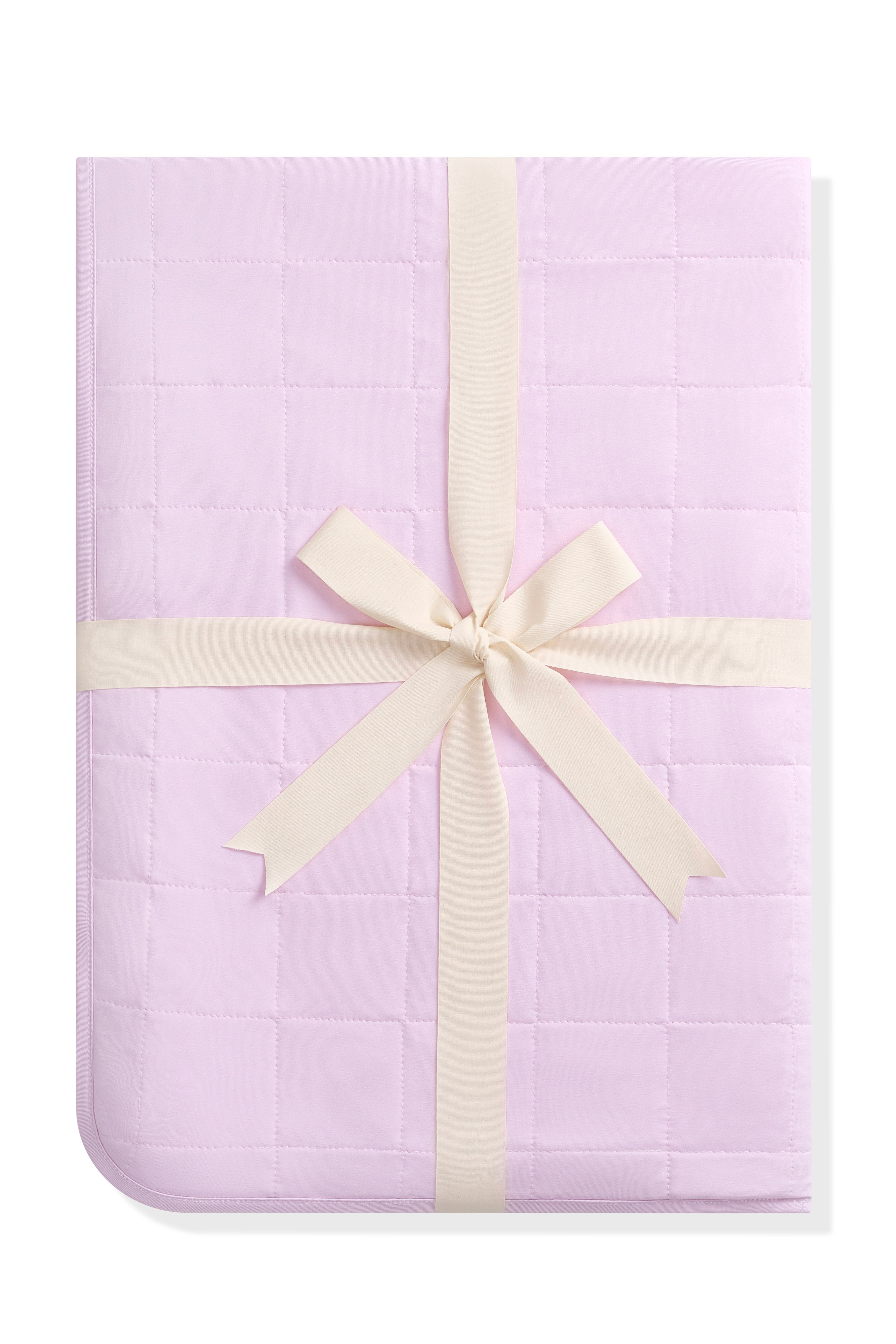Youth Blanket in Thistle 1.0 shown in its packaging tied in a linen bow