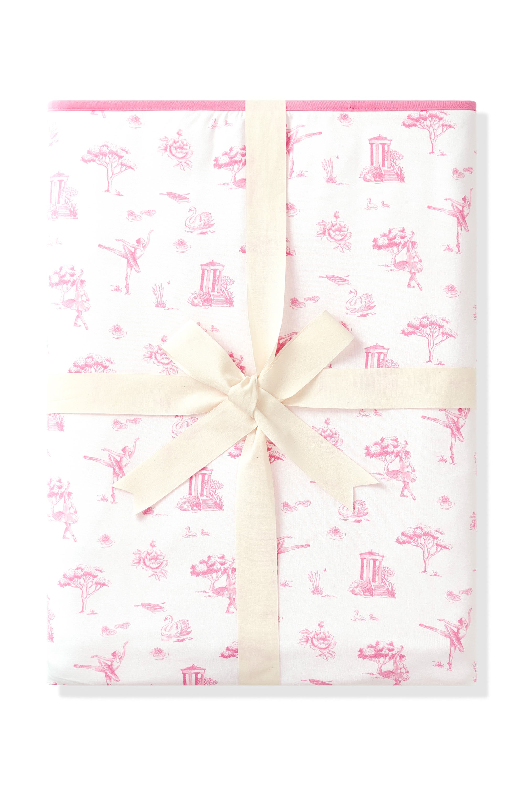 Youth Blanket in Toile Ballet 1.0 shown in its packaging tied with a linen bow
