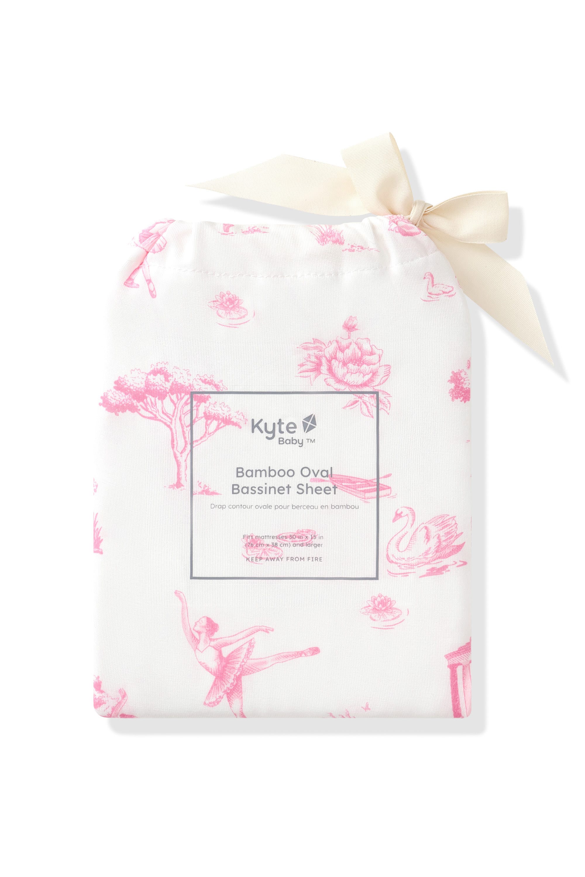 Oval Bassinet Sheet in Toile Ballet shown in its packaging