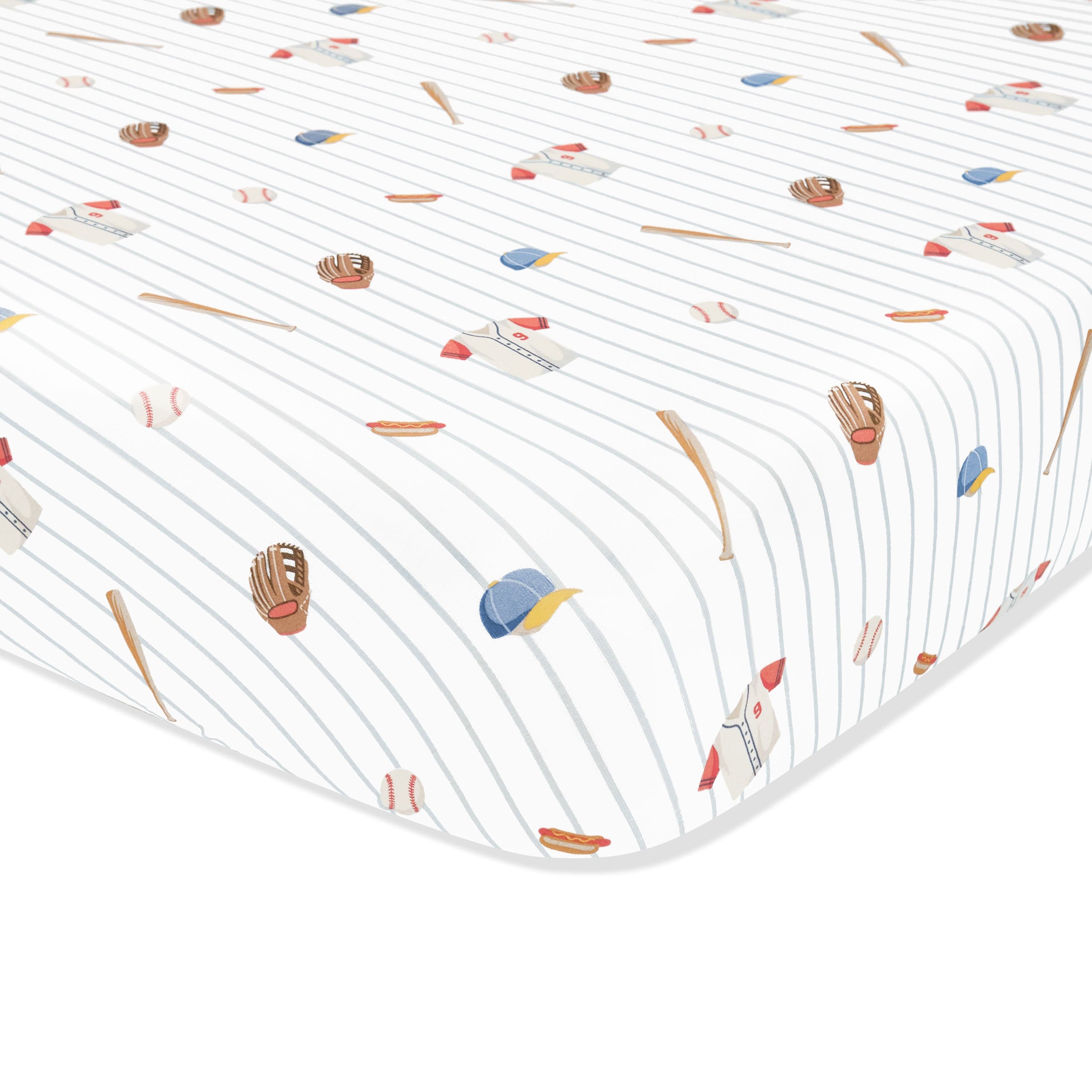 Corner of the Mini Crib Sheet in Home Run shown on a crib mattress