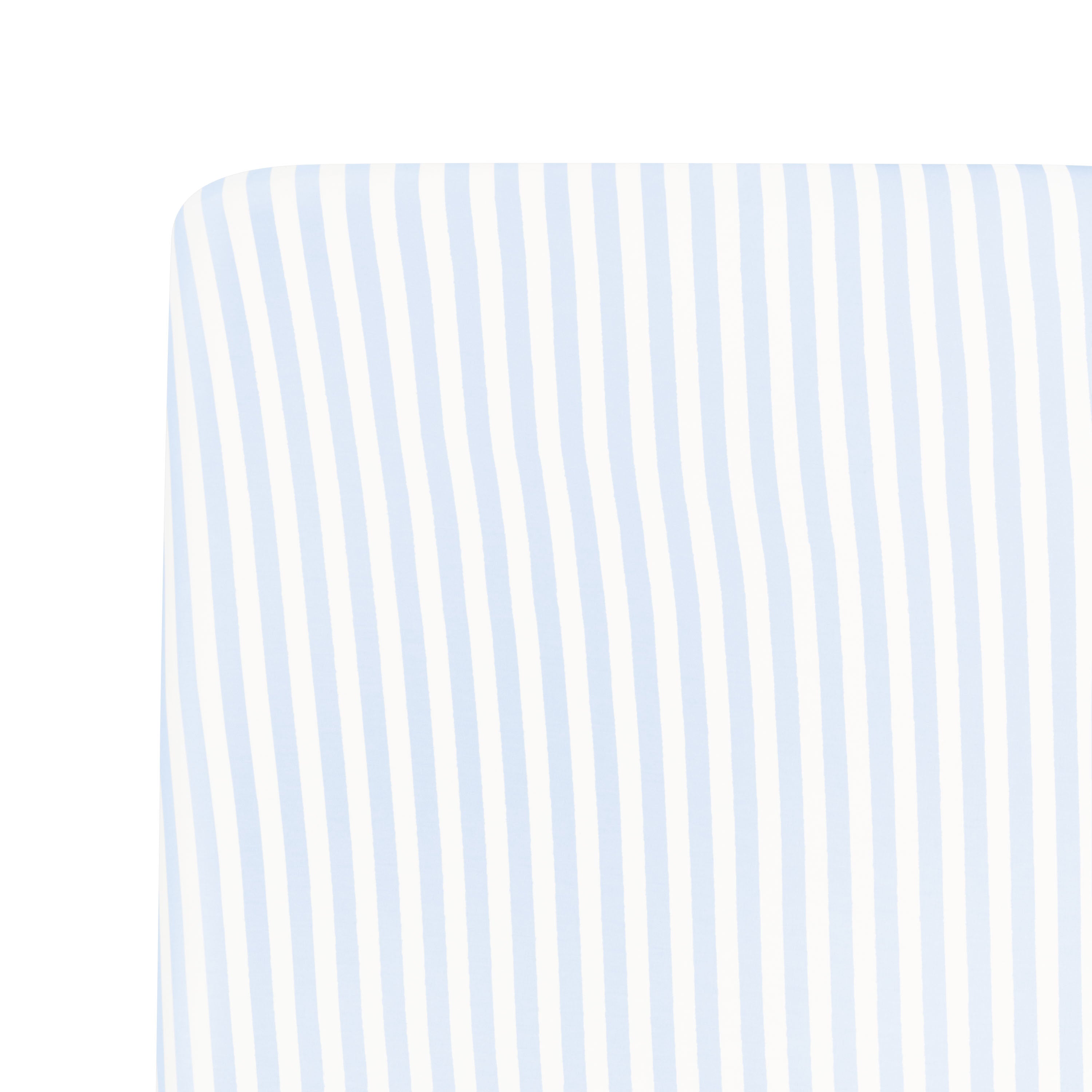 Close up of the Mini Crib Sheet in Small Mist Stripe shown on a mattress