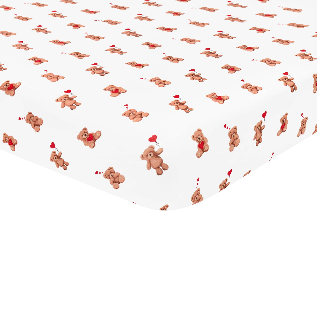 The soft and breathable Crib Sheet in Bear Hearts shown on a crib mattress