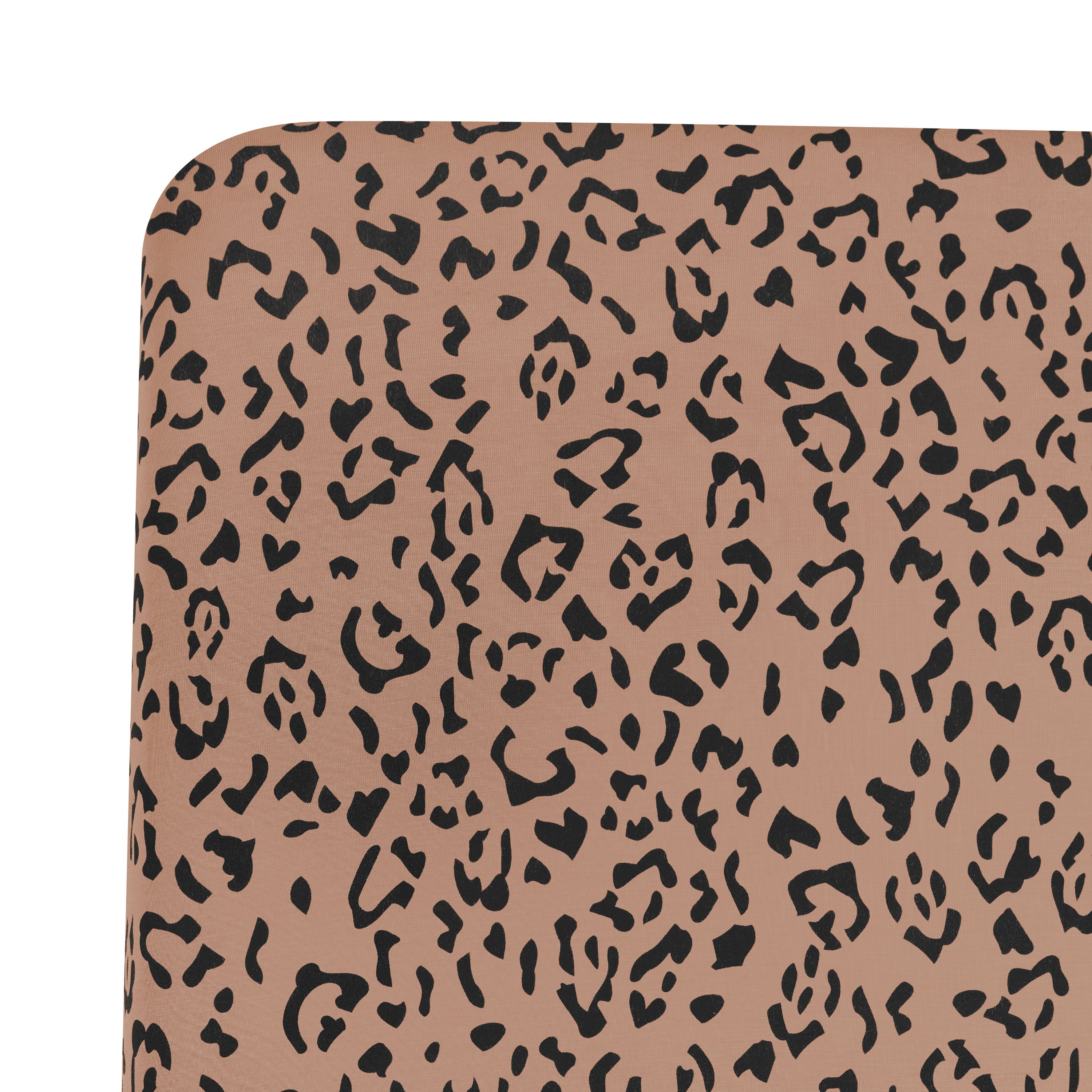 Close up of corner of the Crib Sheet in Latte Leopard shown on a mattress
