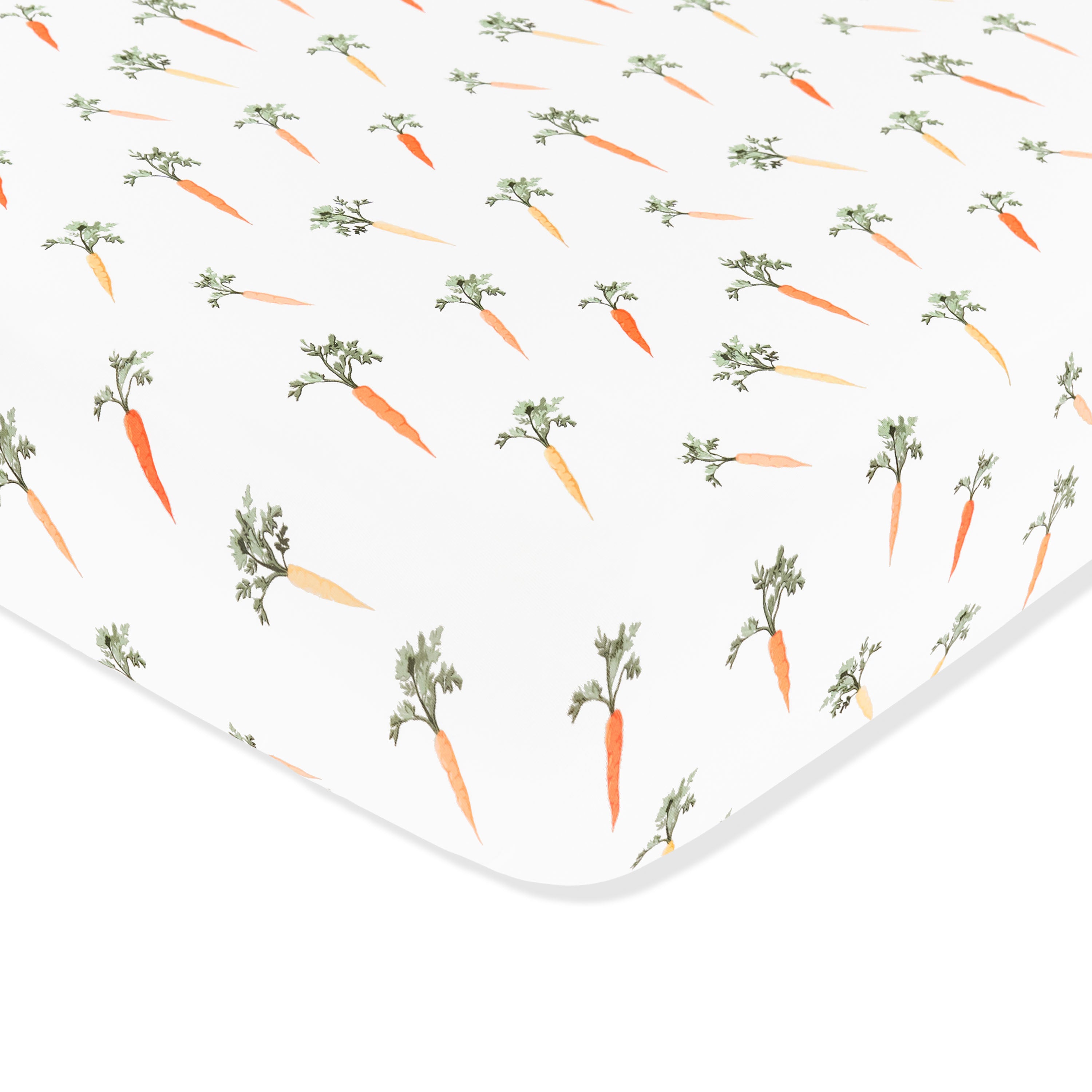 Corner of the Crib Sheet in Carrot shown on a crib mattress