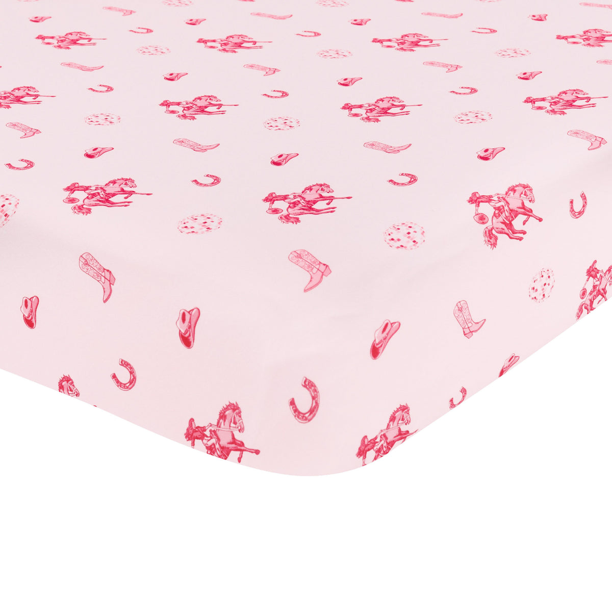 Corner of the Crib Sheet in Disco Cowgirl shown on a crib mattress