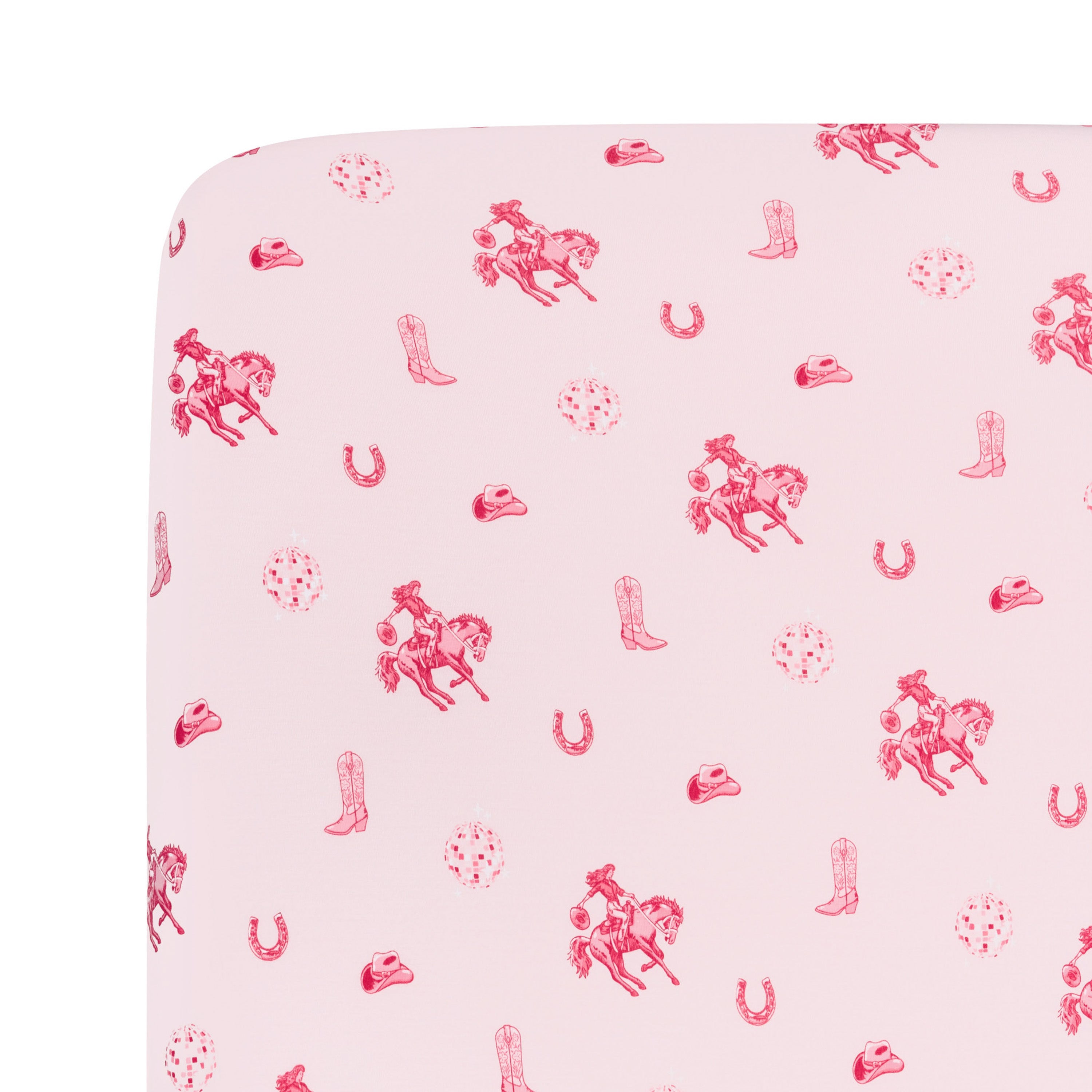 Close up of the Crib Sheet in Disco Cowgirl on a mattress