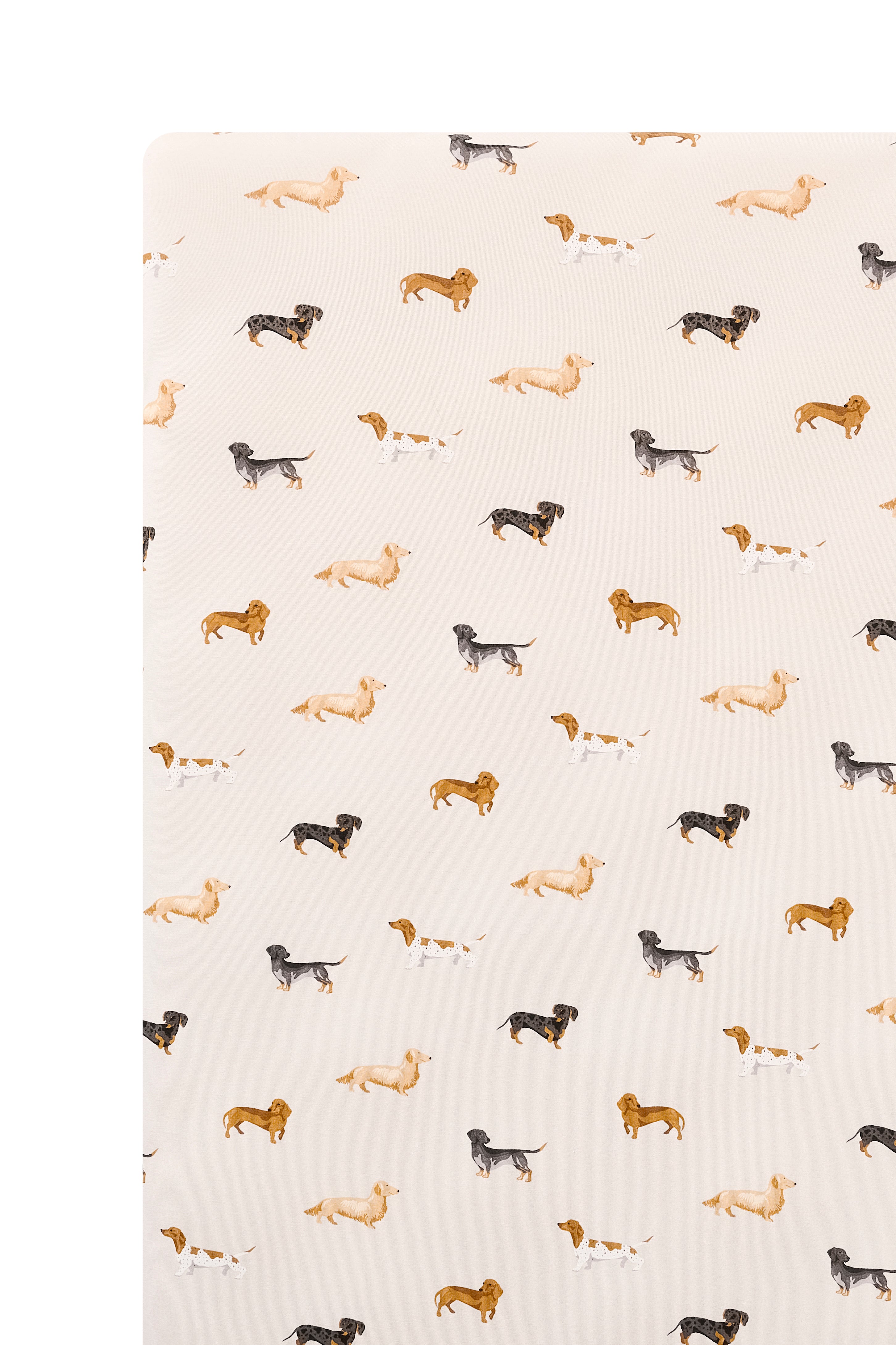 Beige Crib sheet with Dachshund print on a white background
