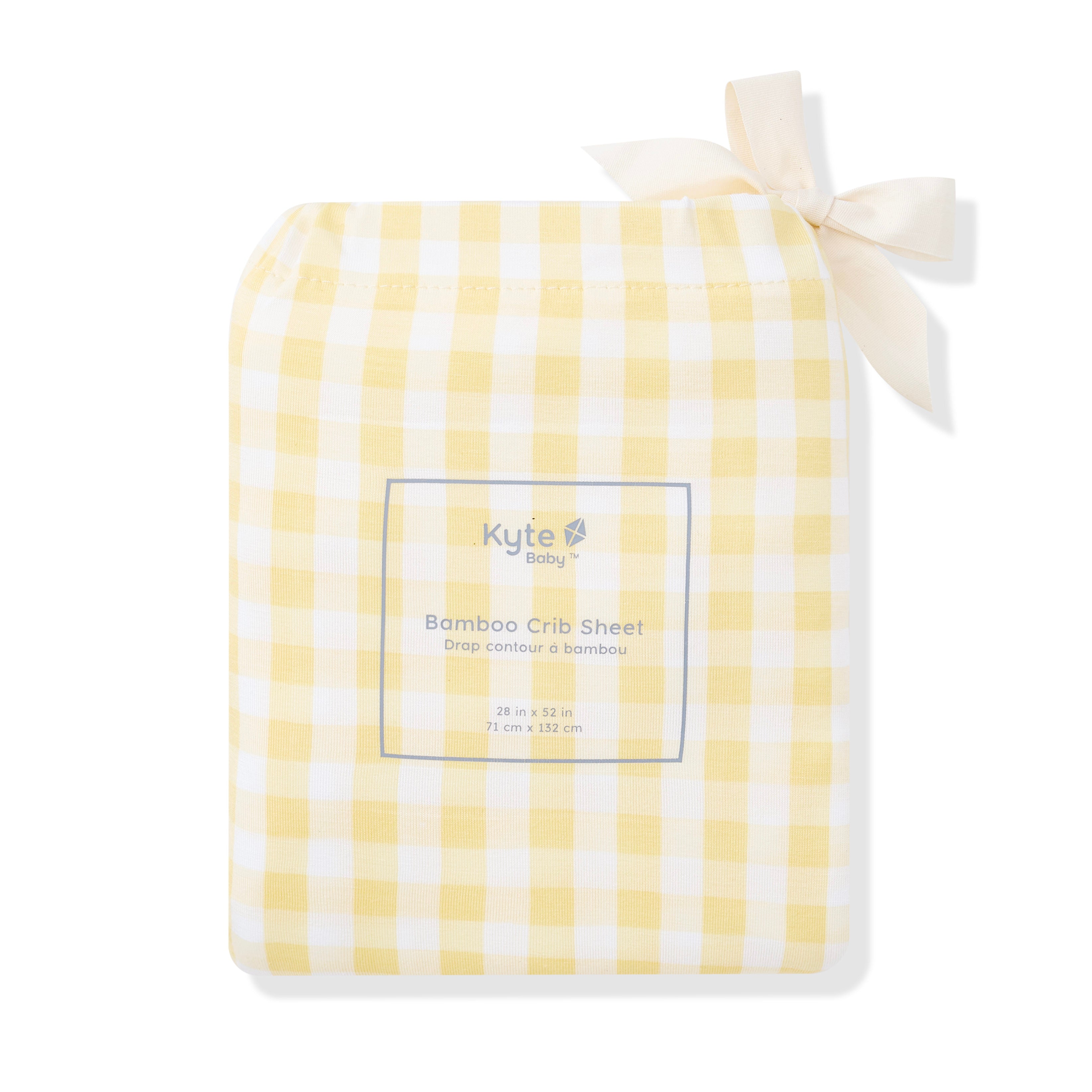 Crib Sheet in Gingham Chamomile shown in its packaging