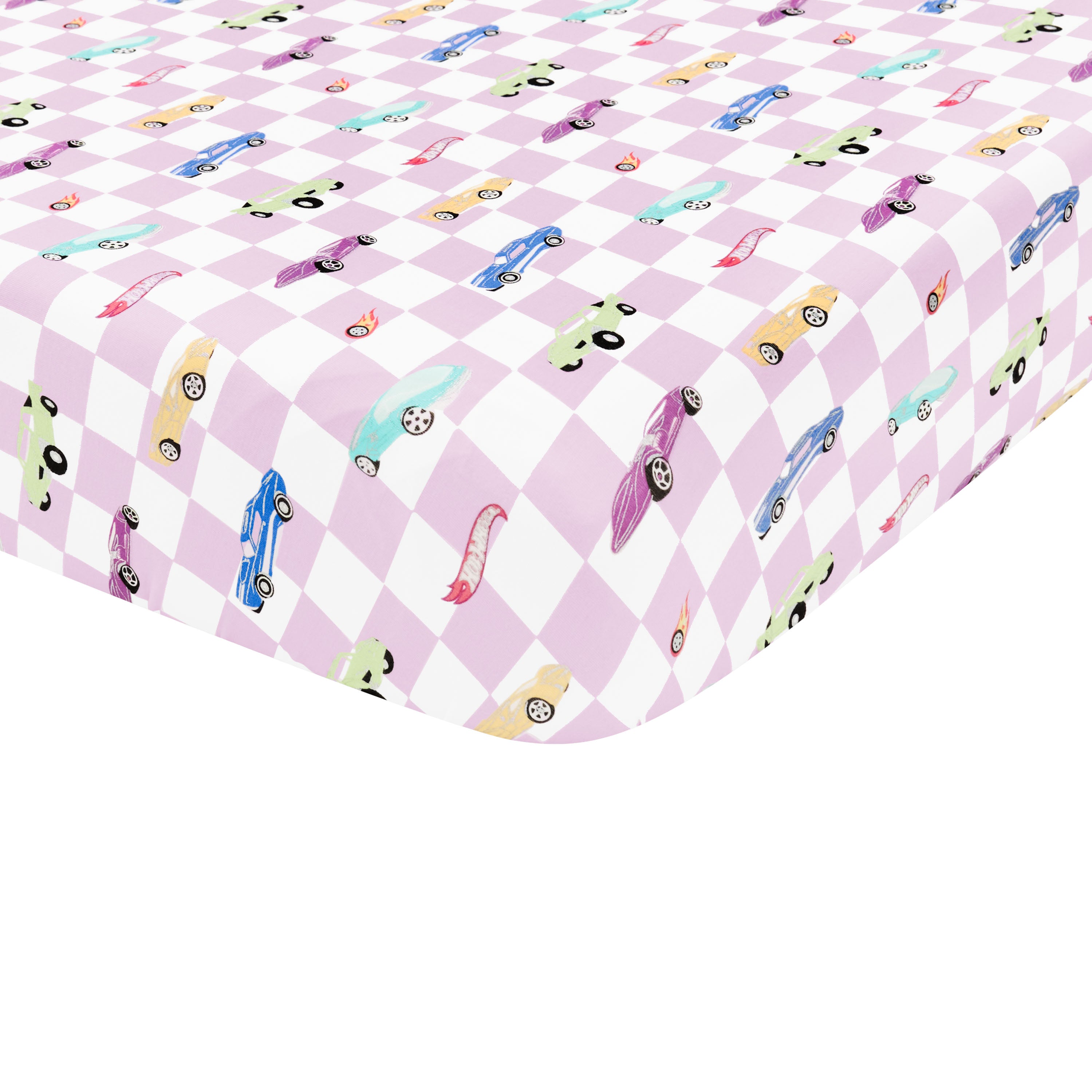 Corner of the Crib Sheet in Sparkles and Speed shown on a mattress