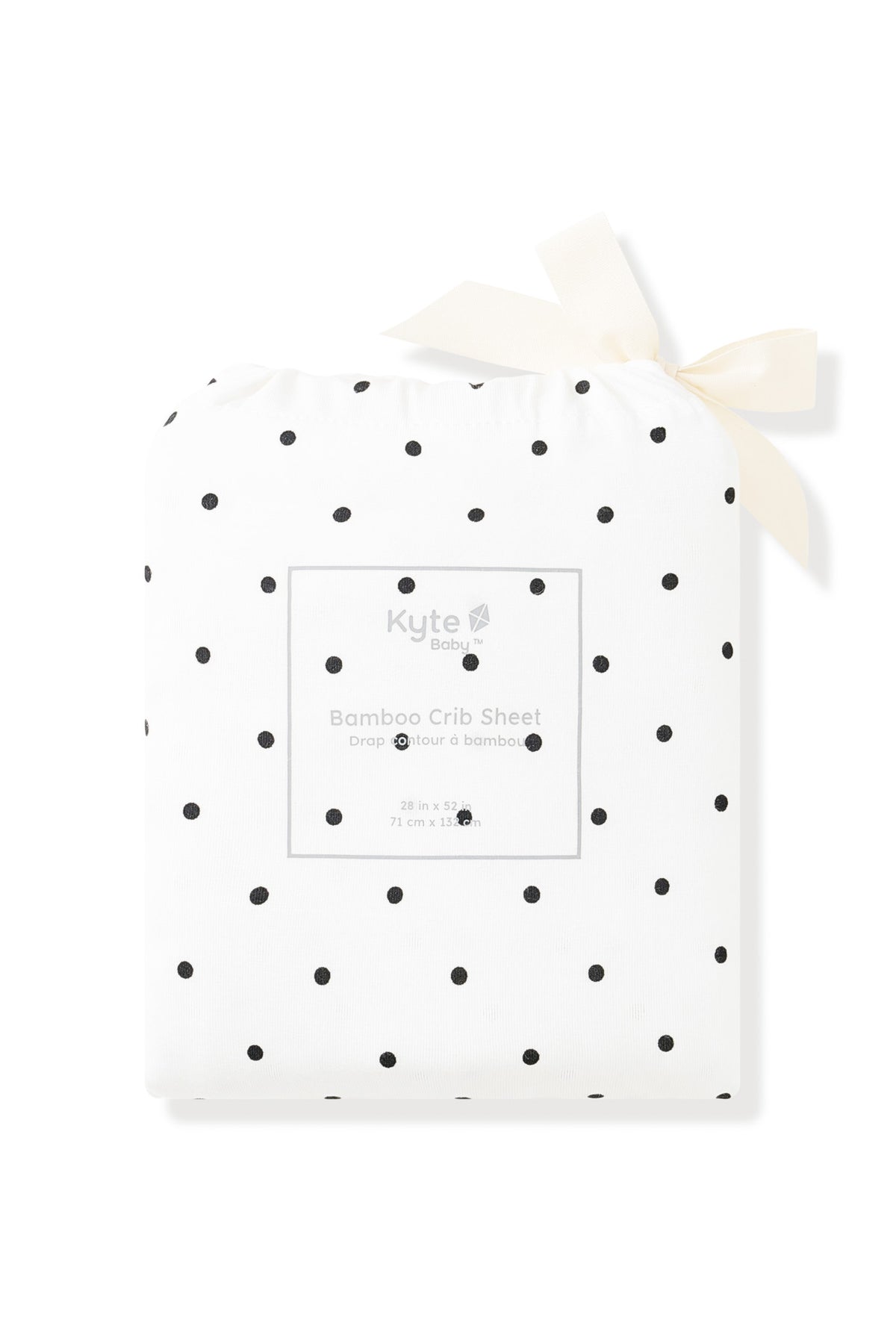 Crib Sheet packed in Midnight Polka Dot print bag on a white background
