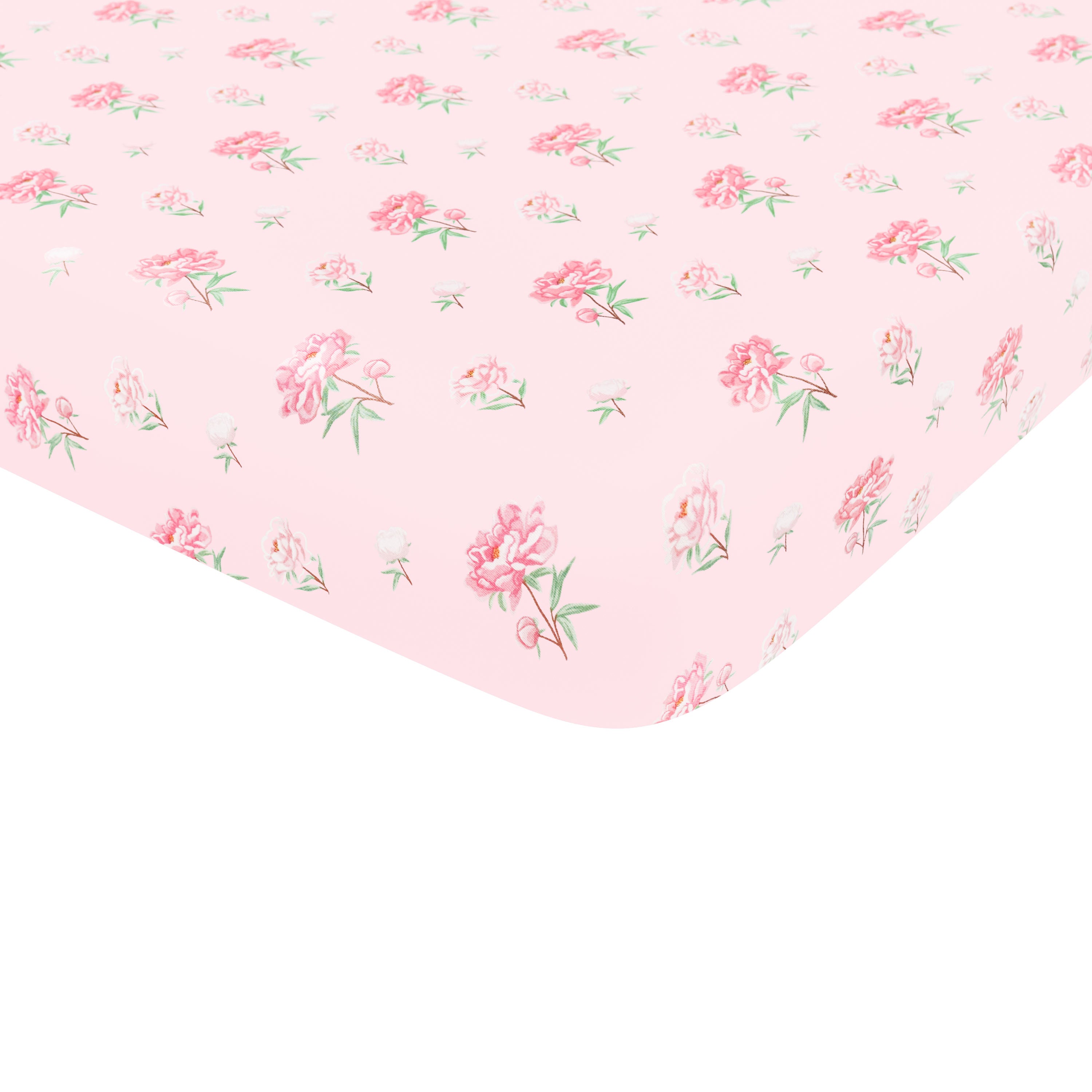 Corner of the Crib Sheet in Sakura Peony shown on a mattress