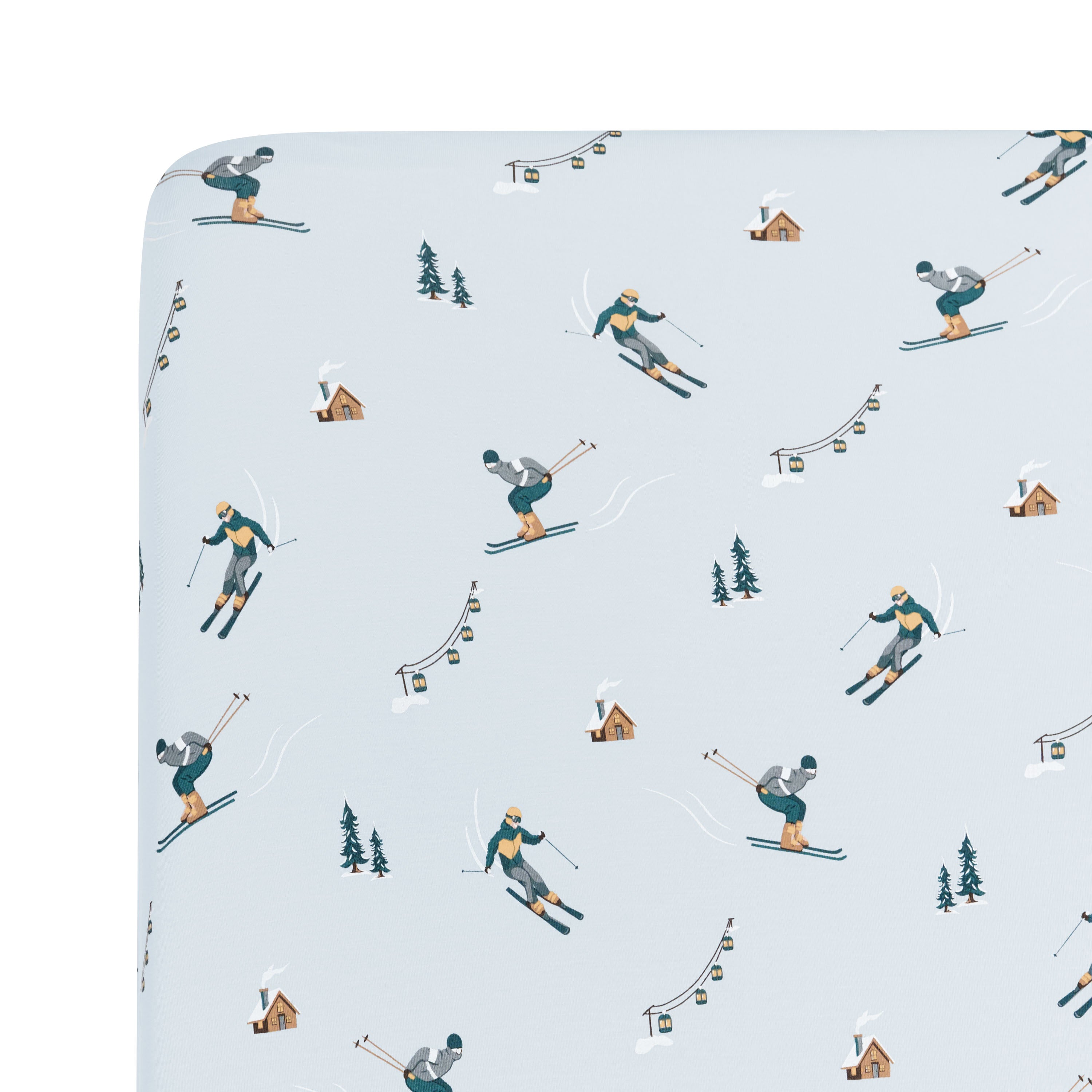 Corner of the Crib Sheet in Ski shown on a crib mattress