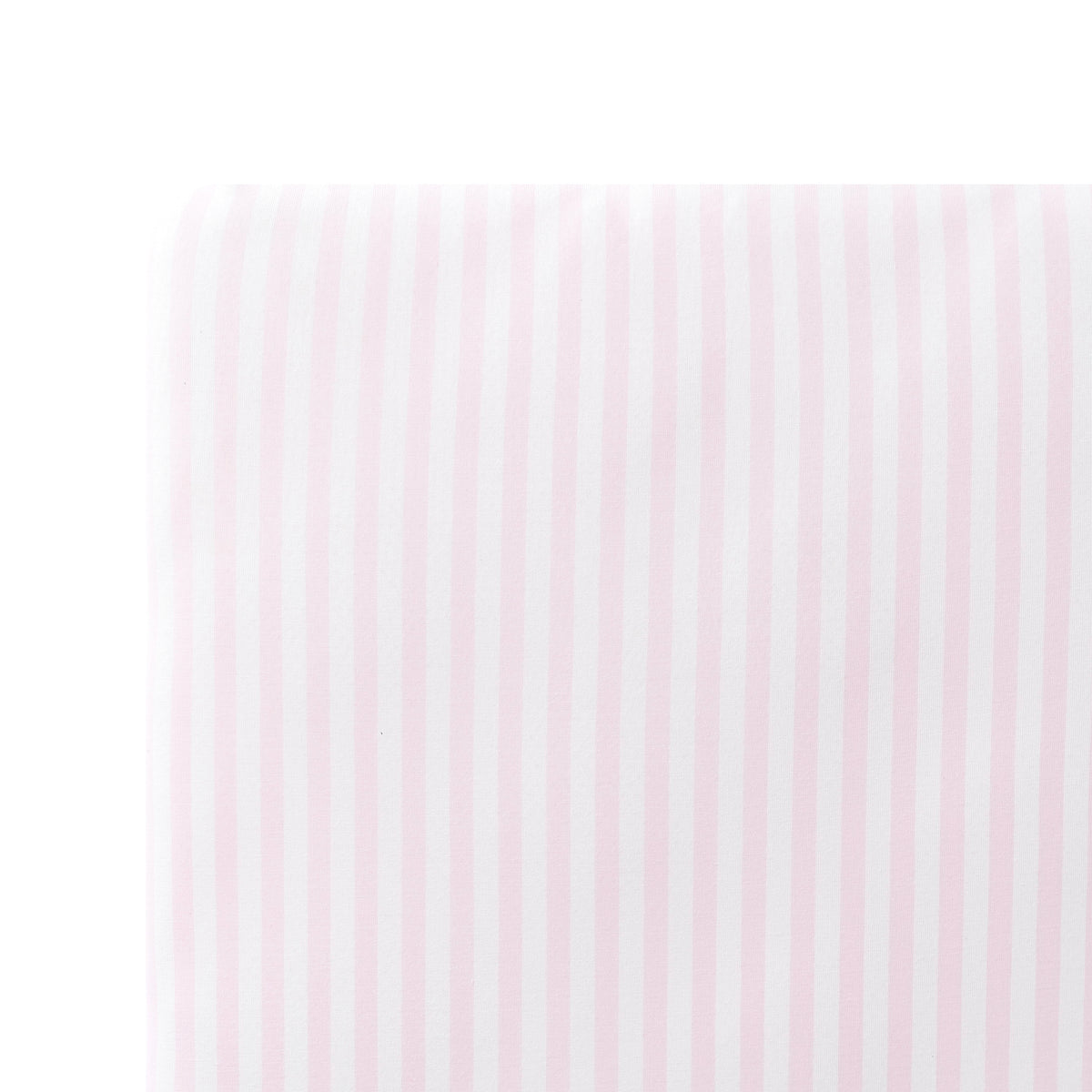 Close up of the Crib Sheet in Small Sakura Stripe shown on a crib mattress