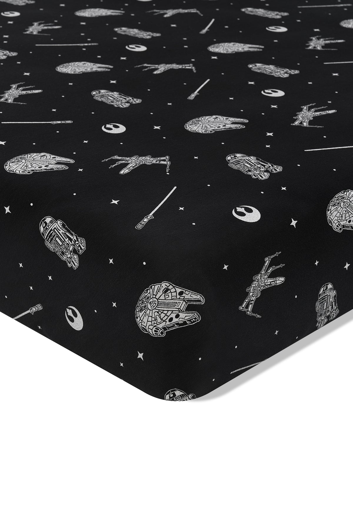 Close up of the corner of the Crib Sheet in STAR WARS™ on a crib mattress