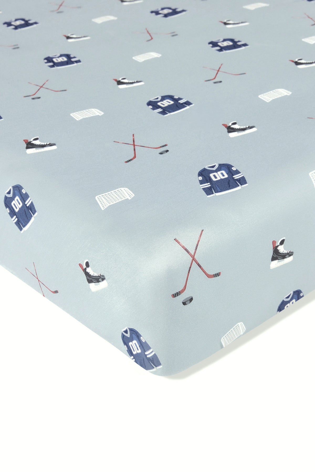 Crib Sheet in Vintage Hockey print on a white background