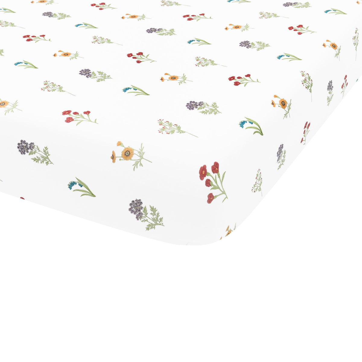Corner of mattress with Crib Sheet in Wildflower on