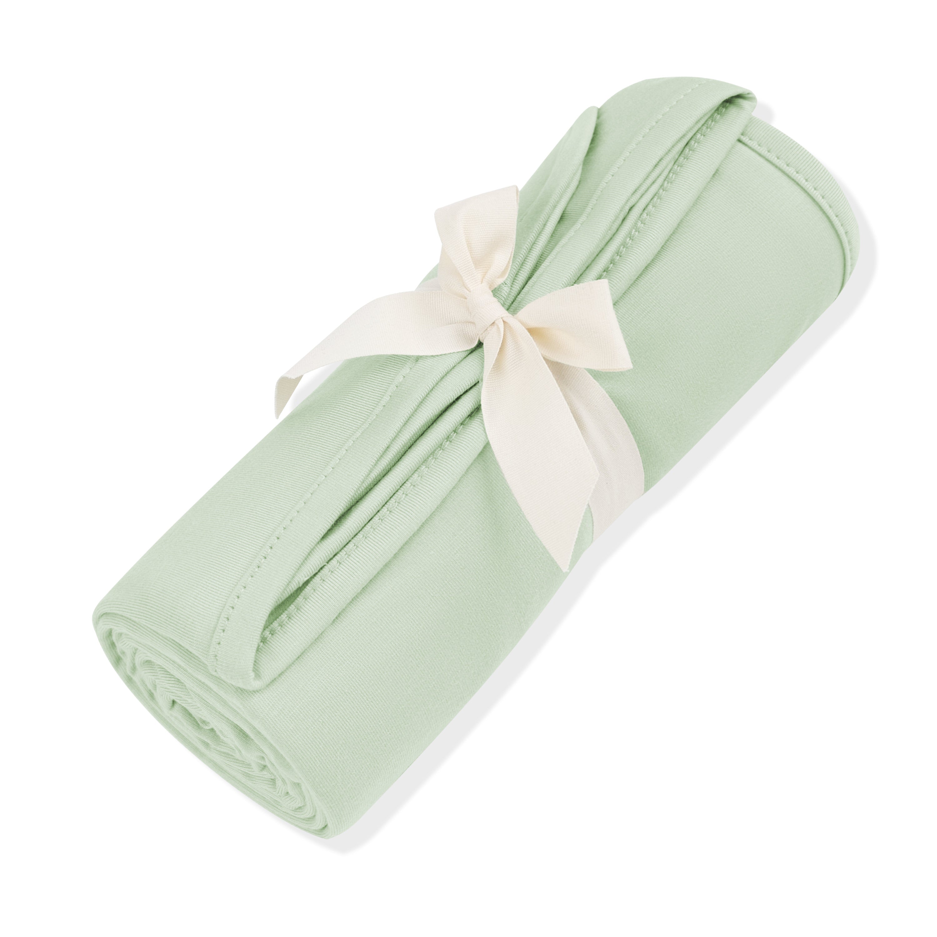 Swaddle Blanket in Basil shown rolled in its packaging wrapped in a linen bow