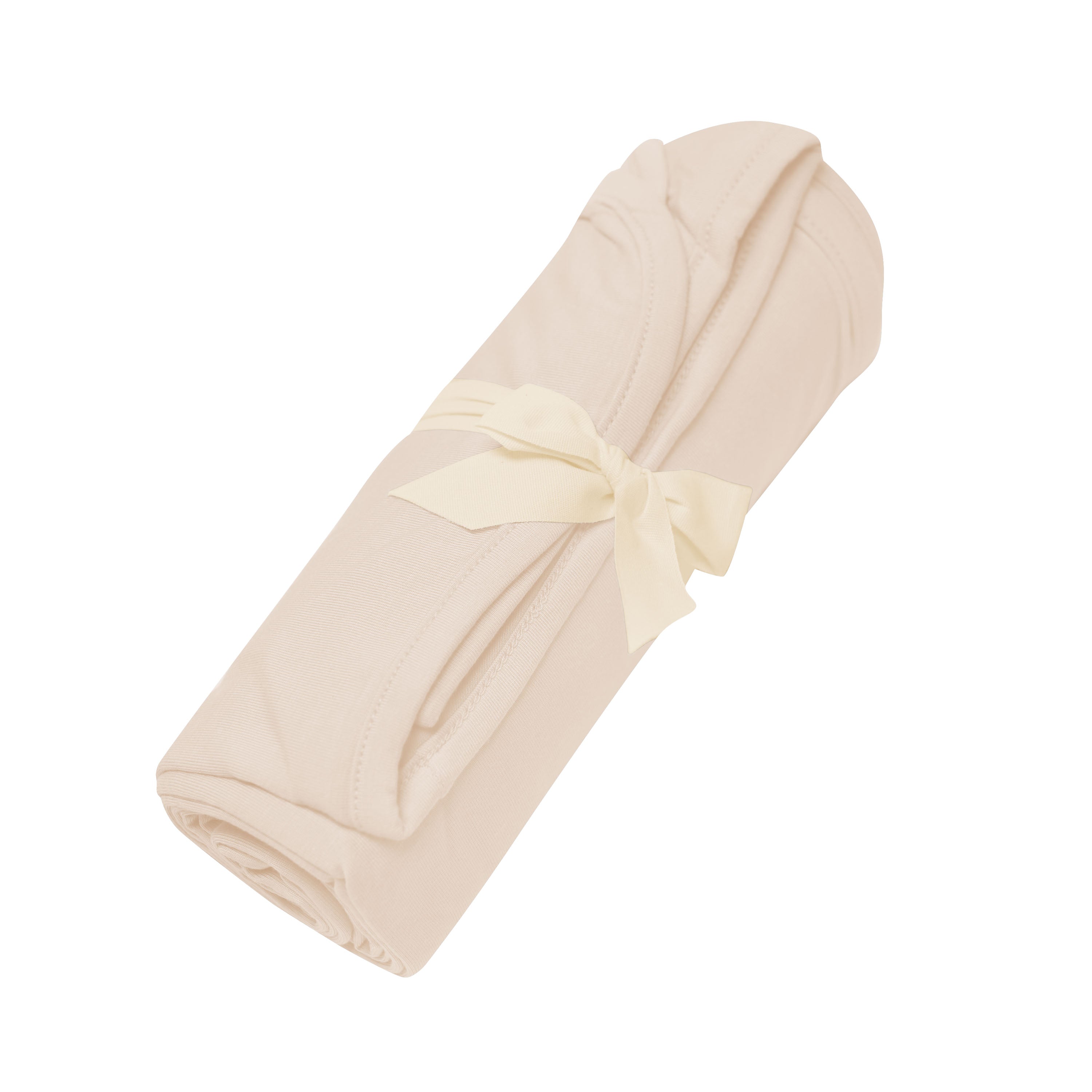 Swaddle Blanket in Bisque shown rolled in its packaging