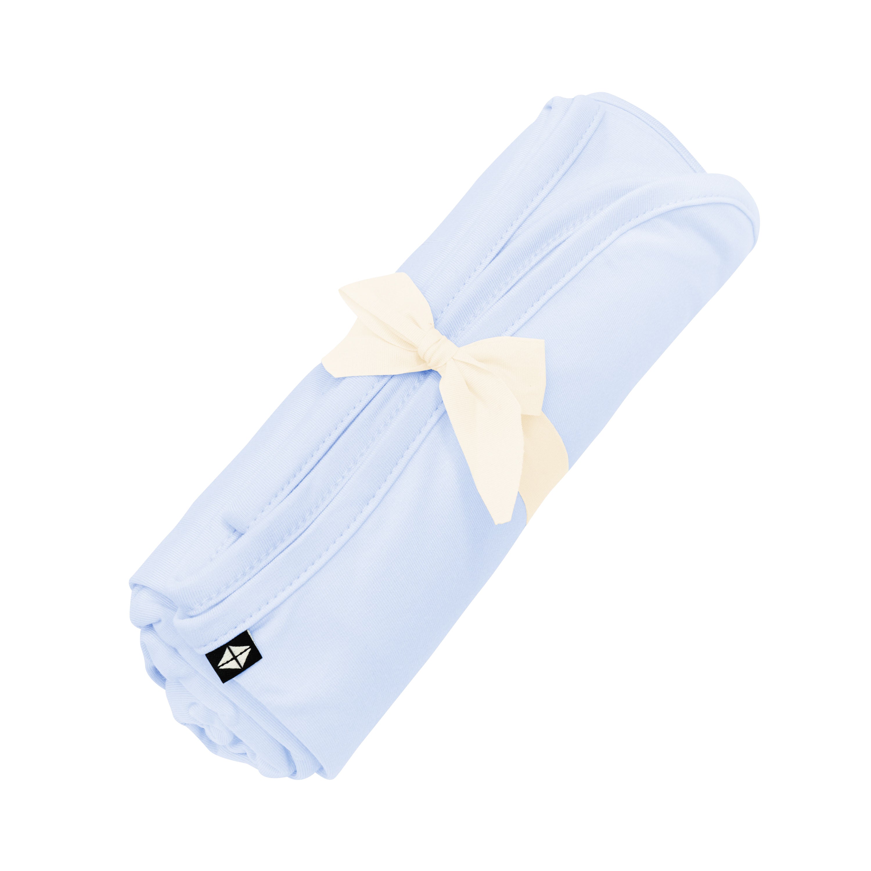 Swaddle Blanket in Mist shown rolled in its packaging