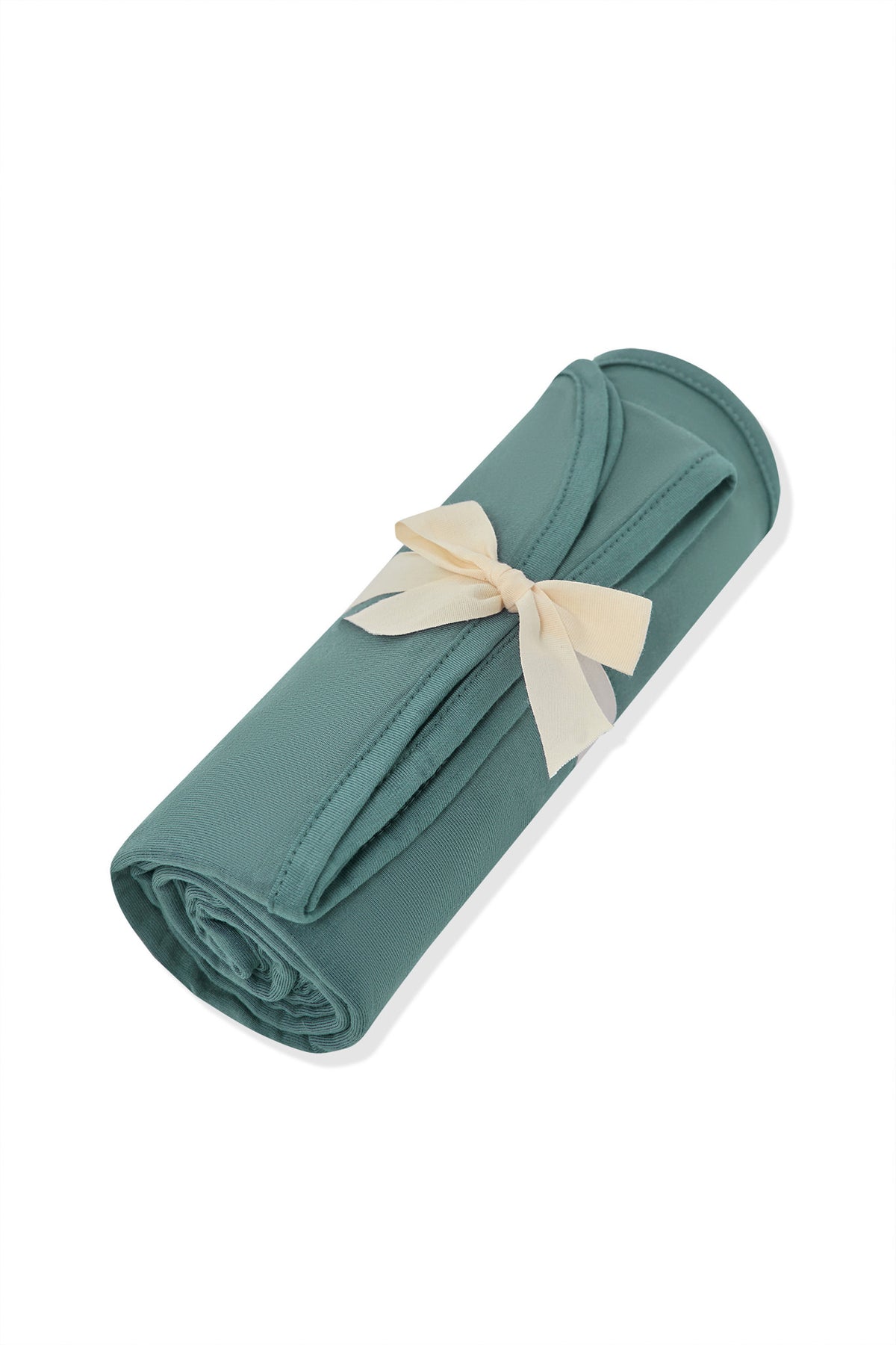 Swaddle Blanket in Pine rolled and tied with a ribbon on a white background