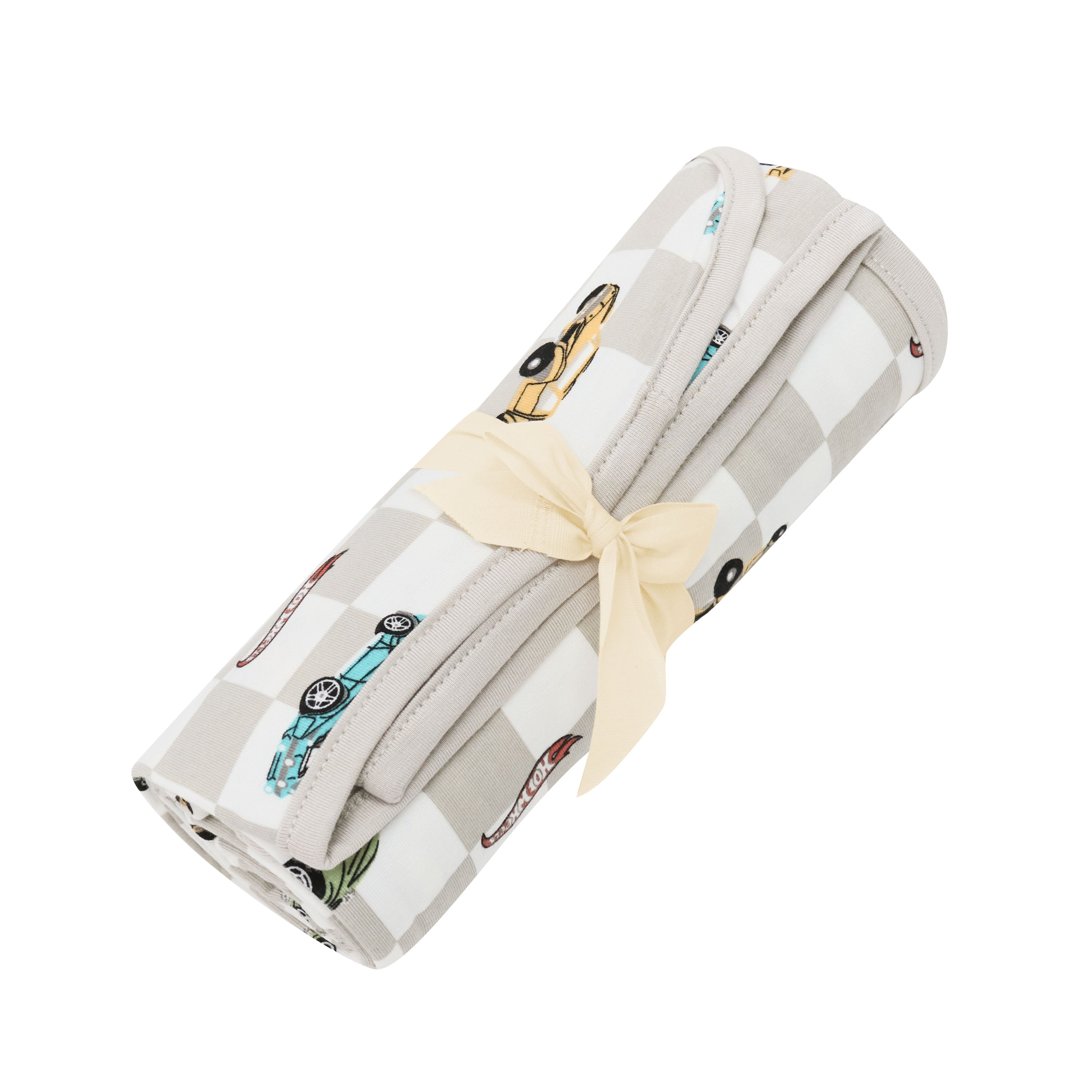 Swaddle Blanket in Fast and Fierce rolled in its packaging