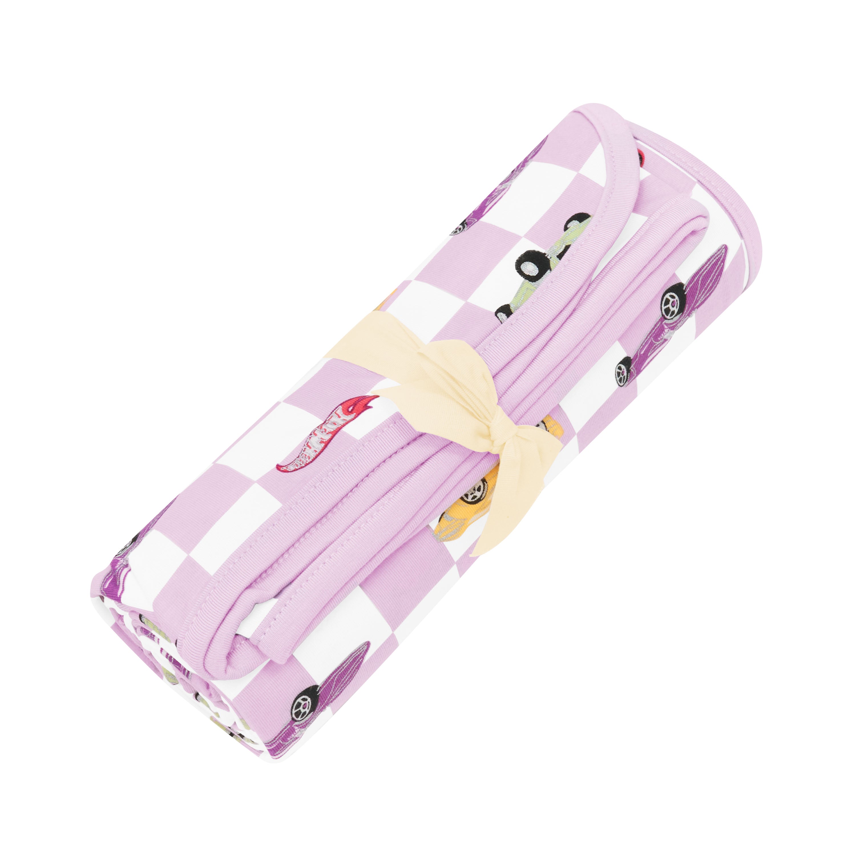 Swaddle Blanket in Sparkles and Speed shown rolled in its packaging