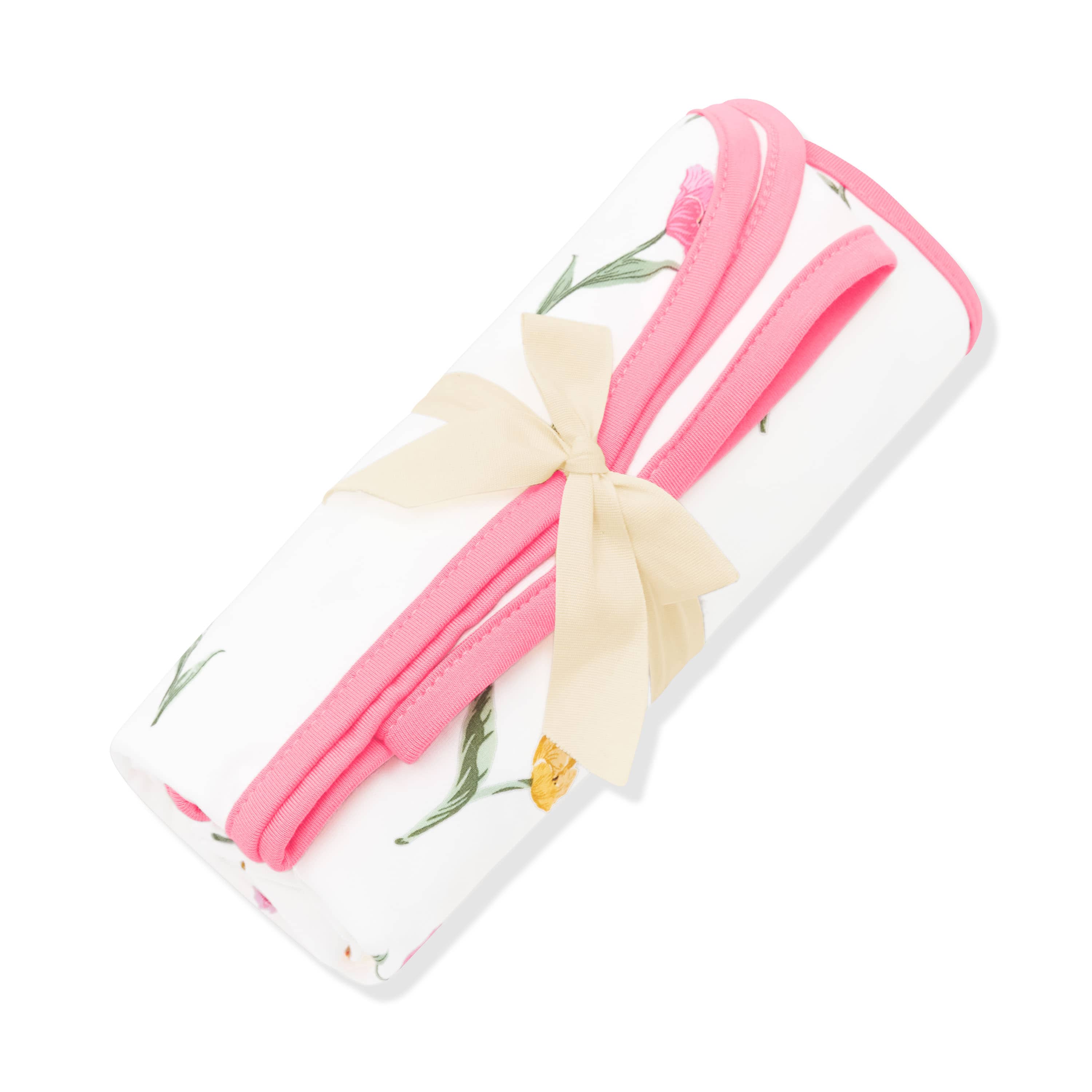 Swaddle Blanket in Tulip shown rolled in its packaging