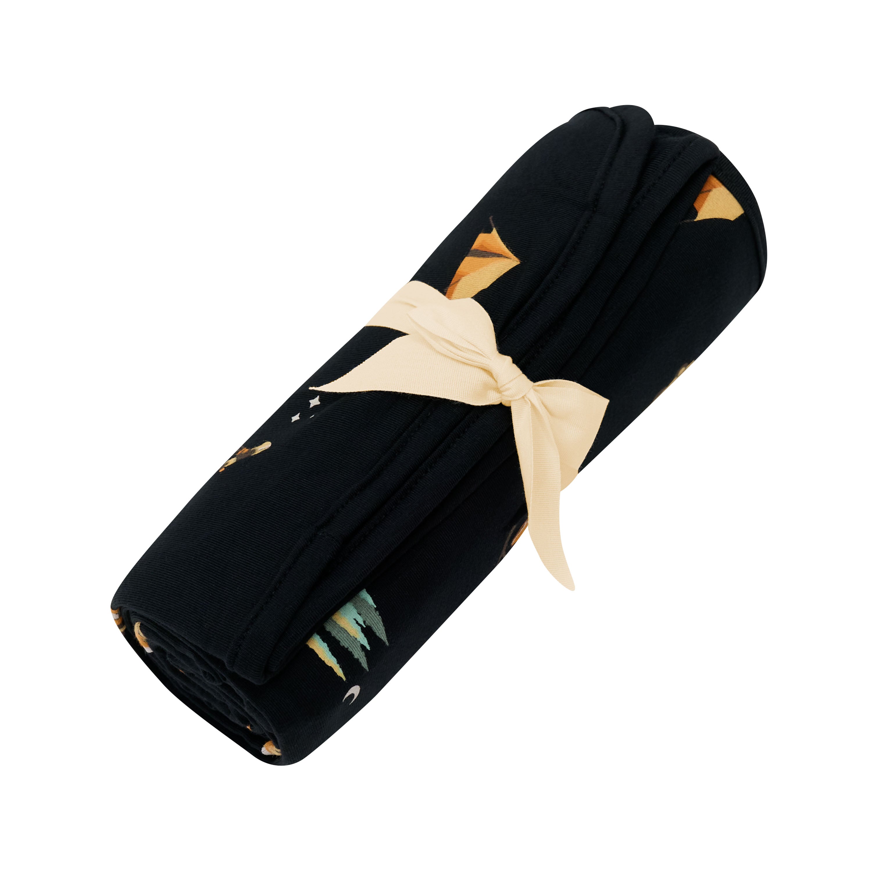 Swaddle Blanket in Under the Stars shown rolled up in its packaging