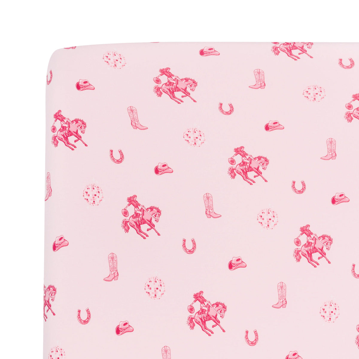 Close up of the Twin Sheet in Disco Cowgirl shown on a mattress