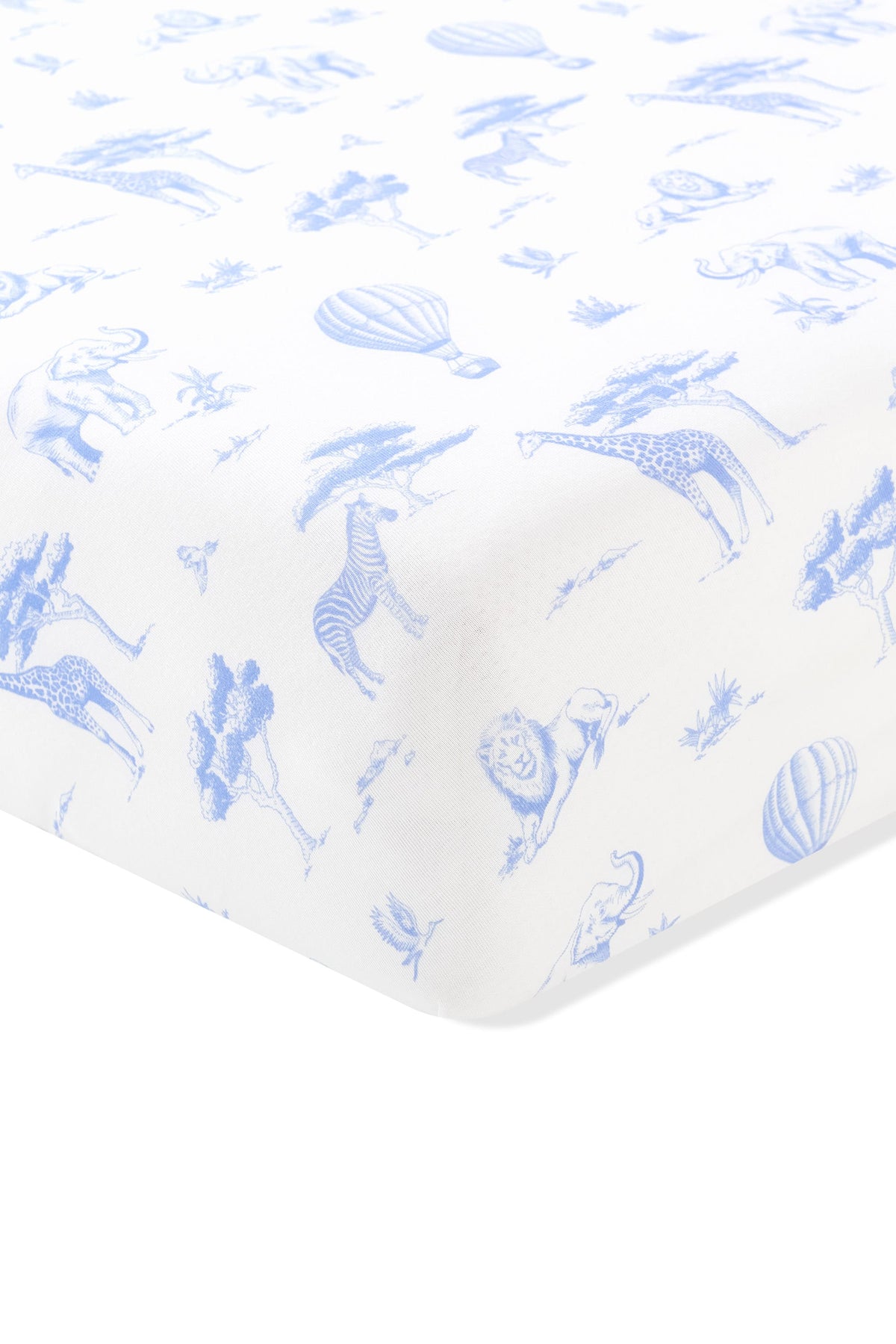 The corner of the Twin Sheet in Toile Safari shown on a mattress
