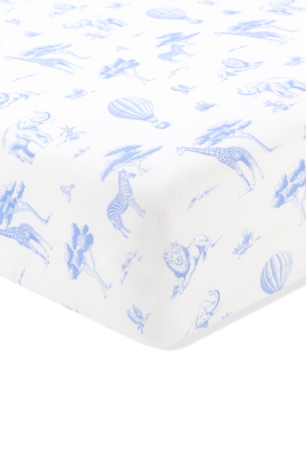 The corner of the Twin Sheet in Toile Safari shown on a mattress