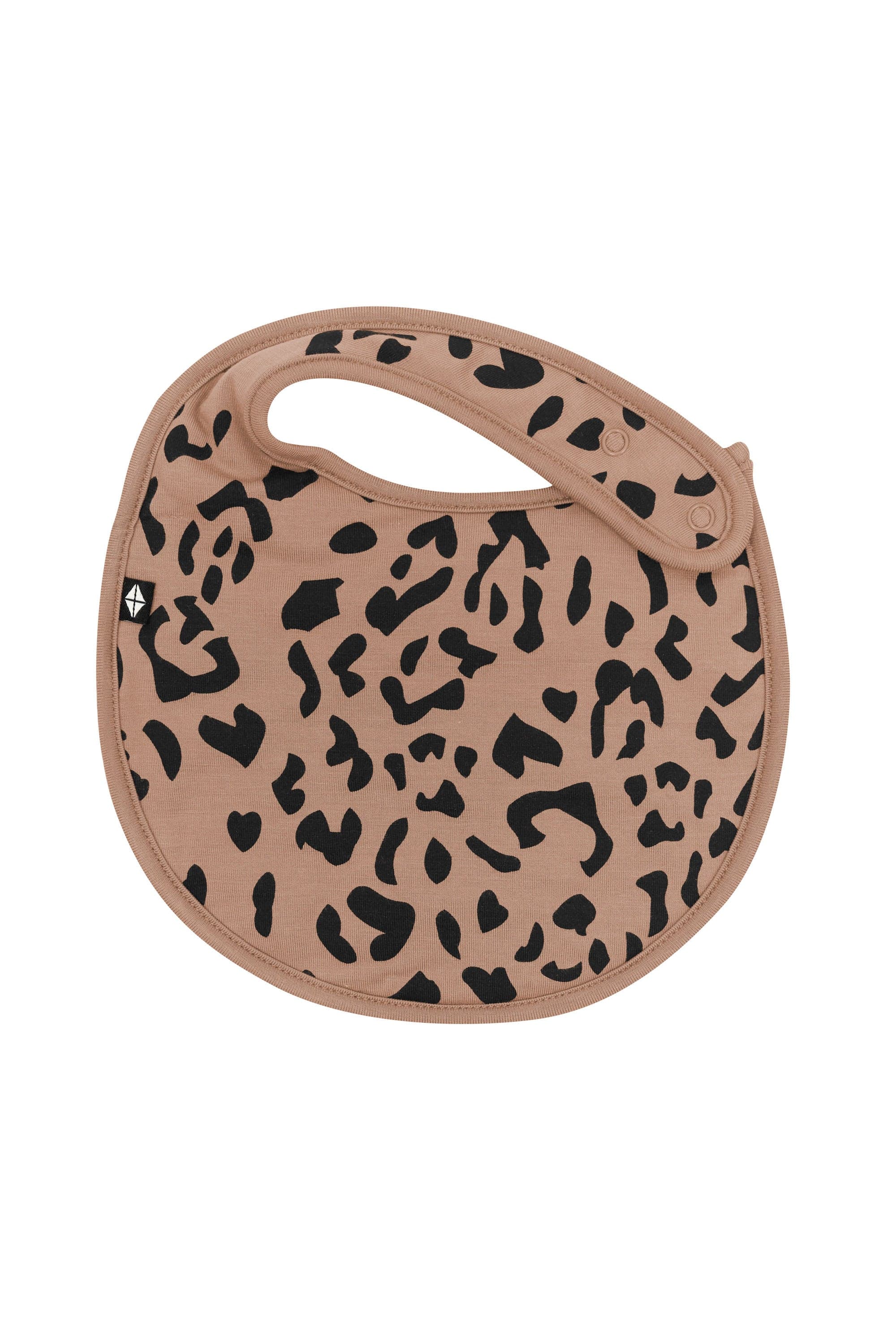 The front of the Cushy Bib in Latte Leopard showing the snap closure