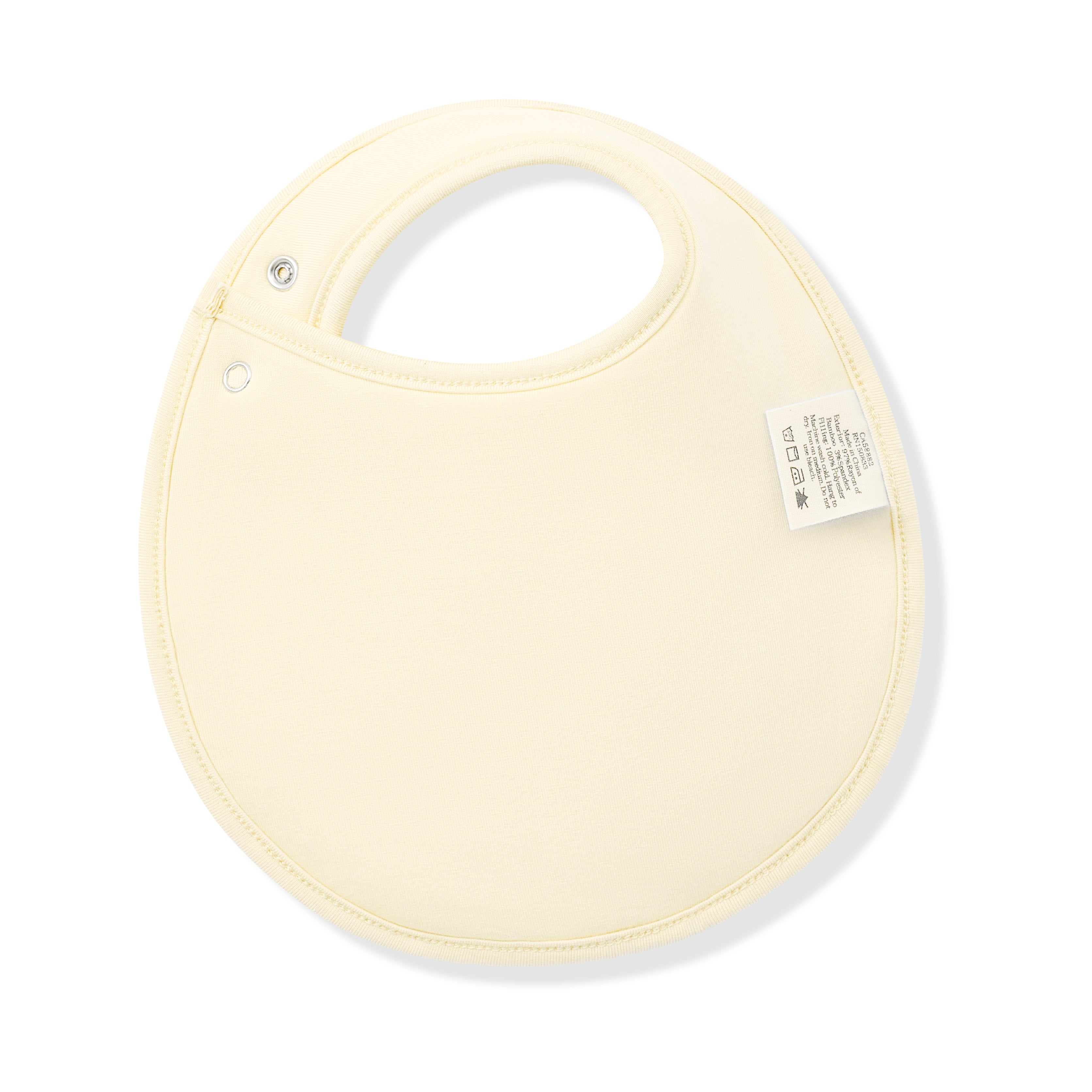 The back of the Cushy Bib in Gingham Chamomile showing the light yellow backing