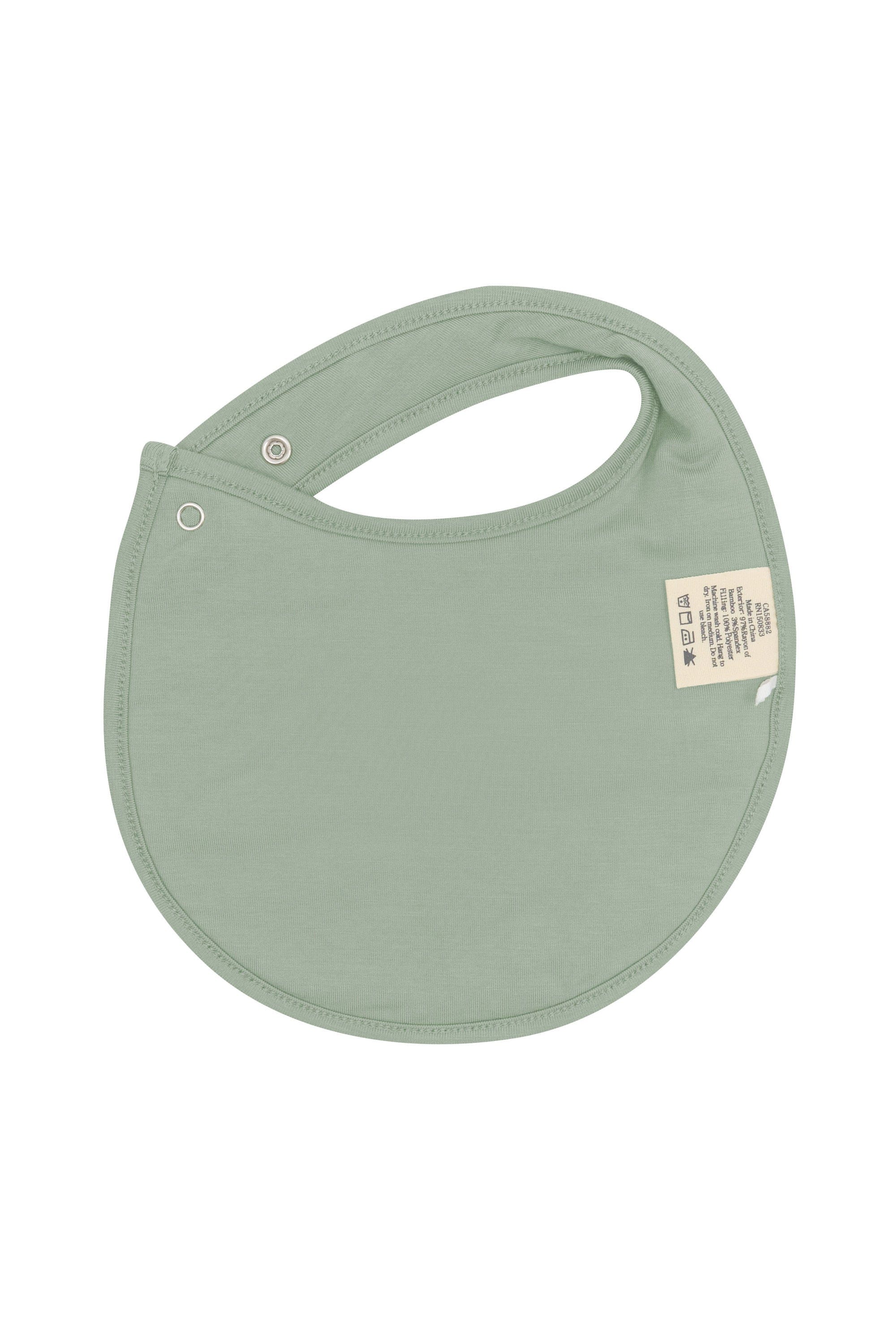 The back of the Cushy Bib in Silly Goose showing the Thyme color backside