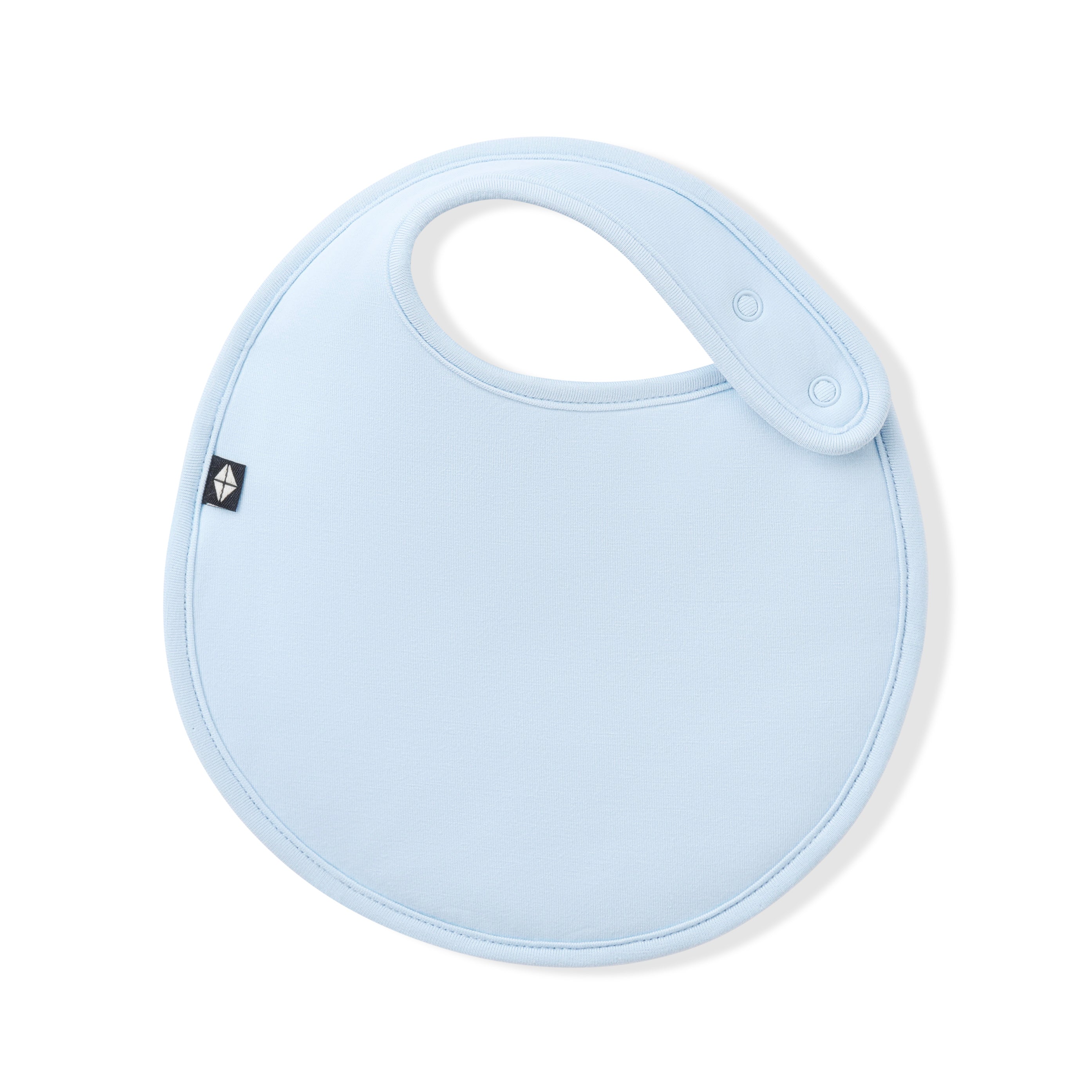 Font of the Cushy Bib in Breeze showing the snap closures