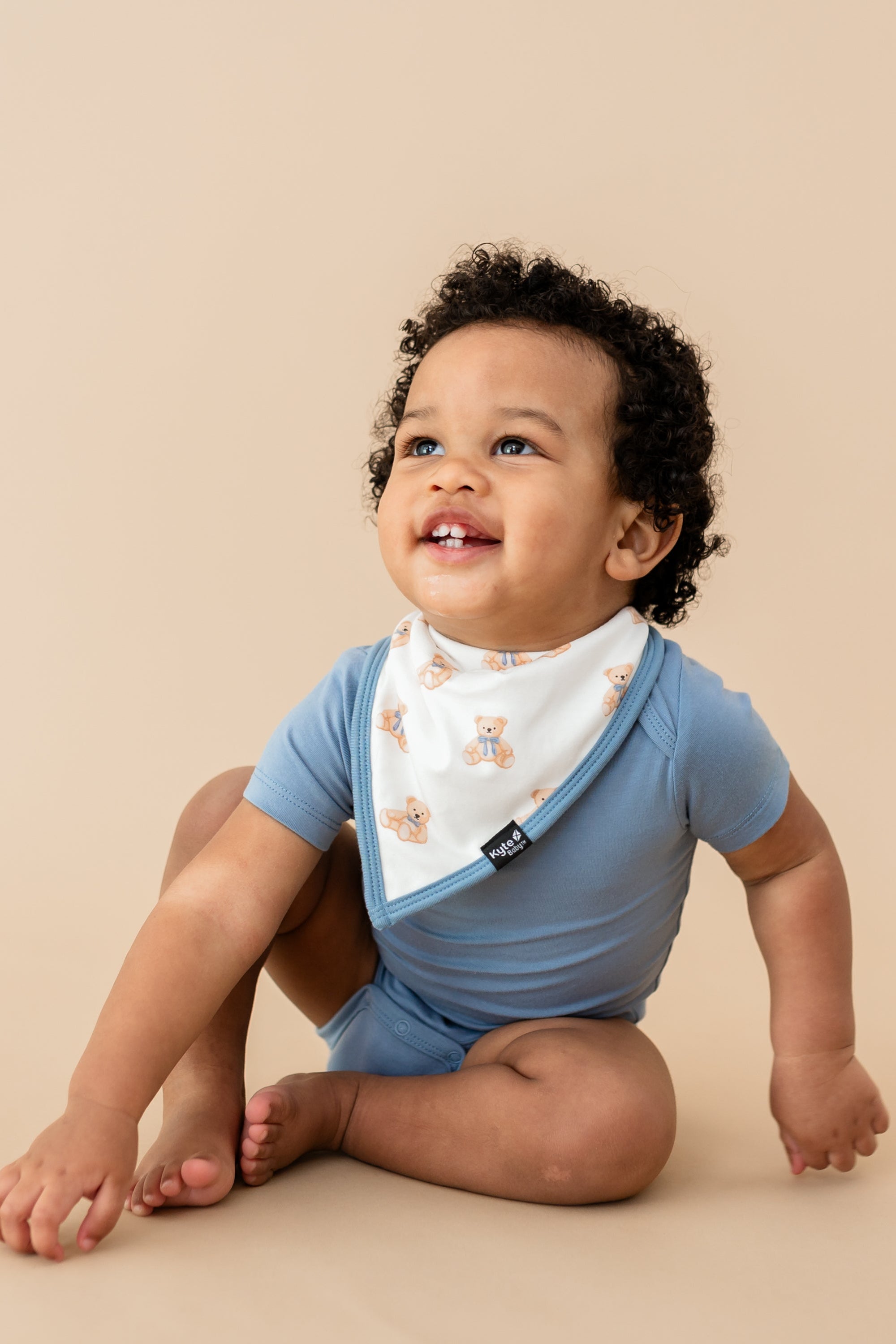 Toddler boy in Slate bodysuit and Bib in Teddy Bear