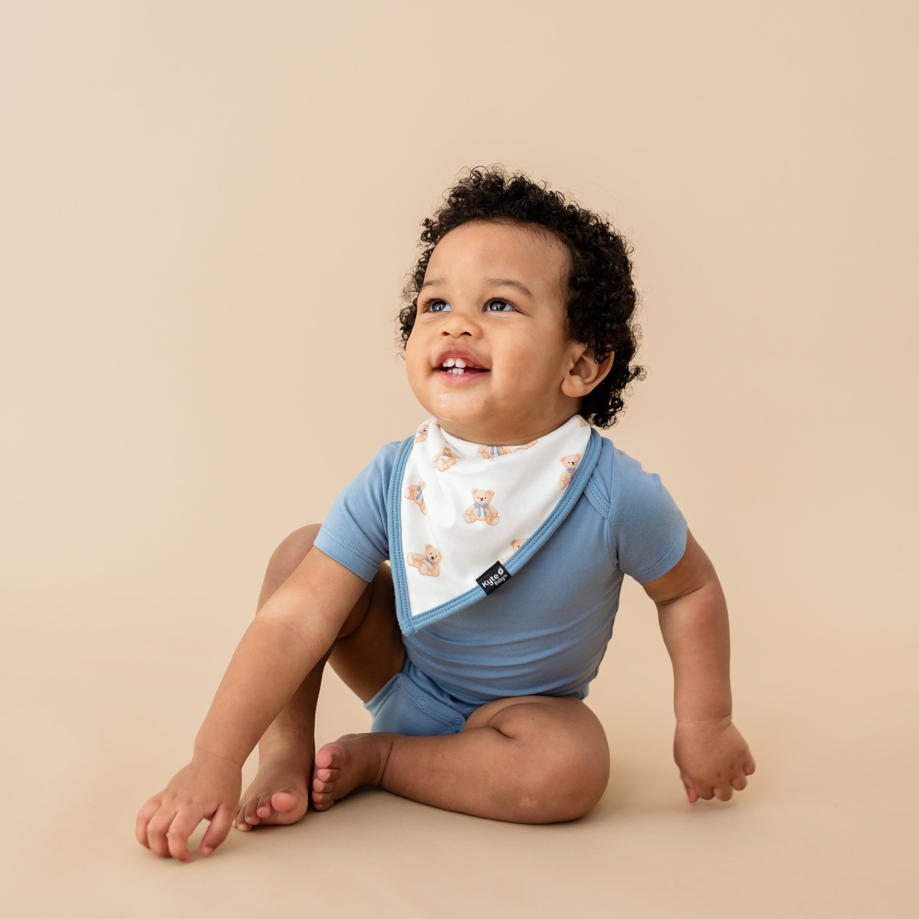 Toddler boy in Slate bodysuit and Bib in Teddy Bear
