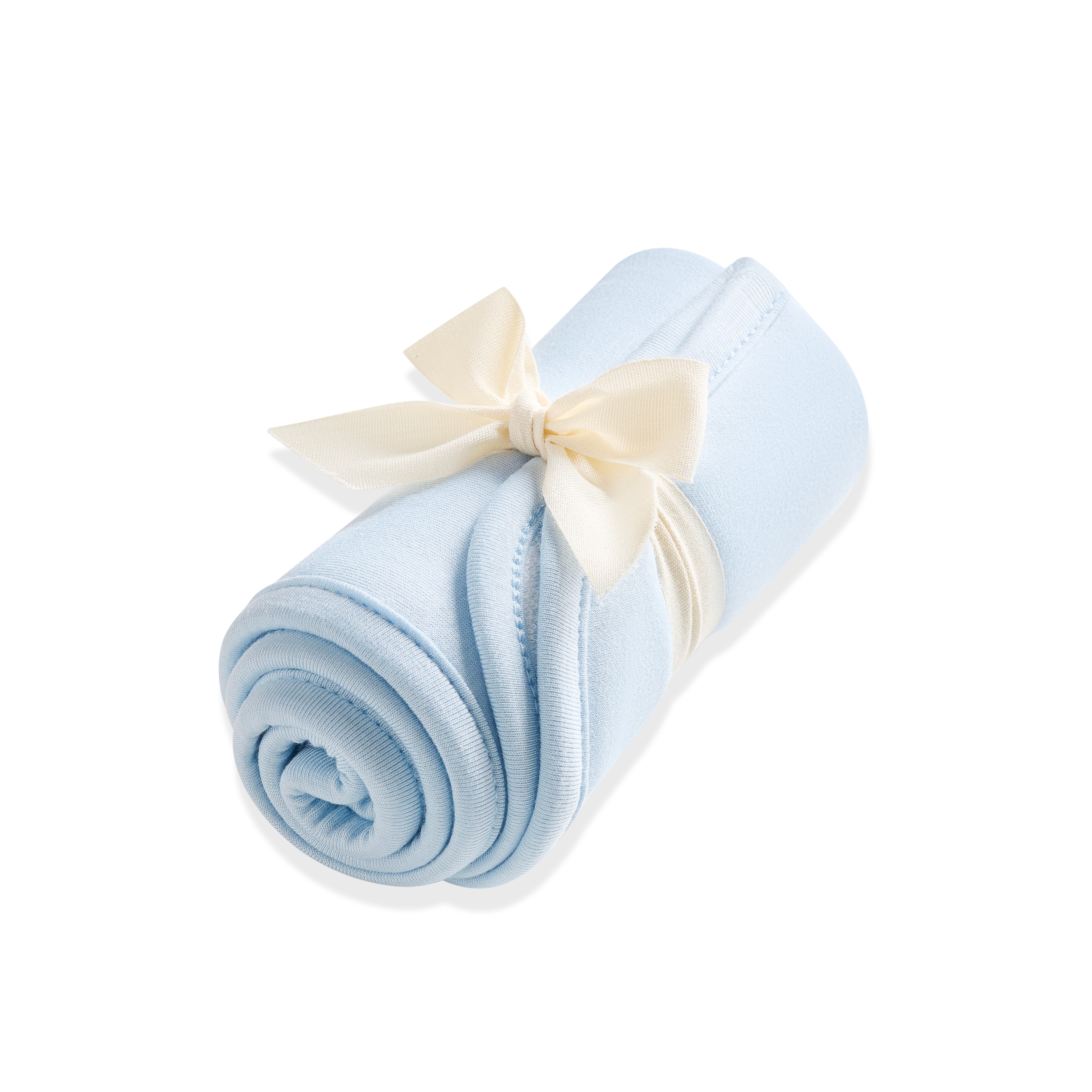 Burp Cloth in Breeze shown rolled in its packaging tied with a linen bow