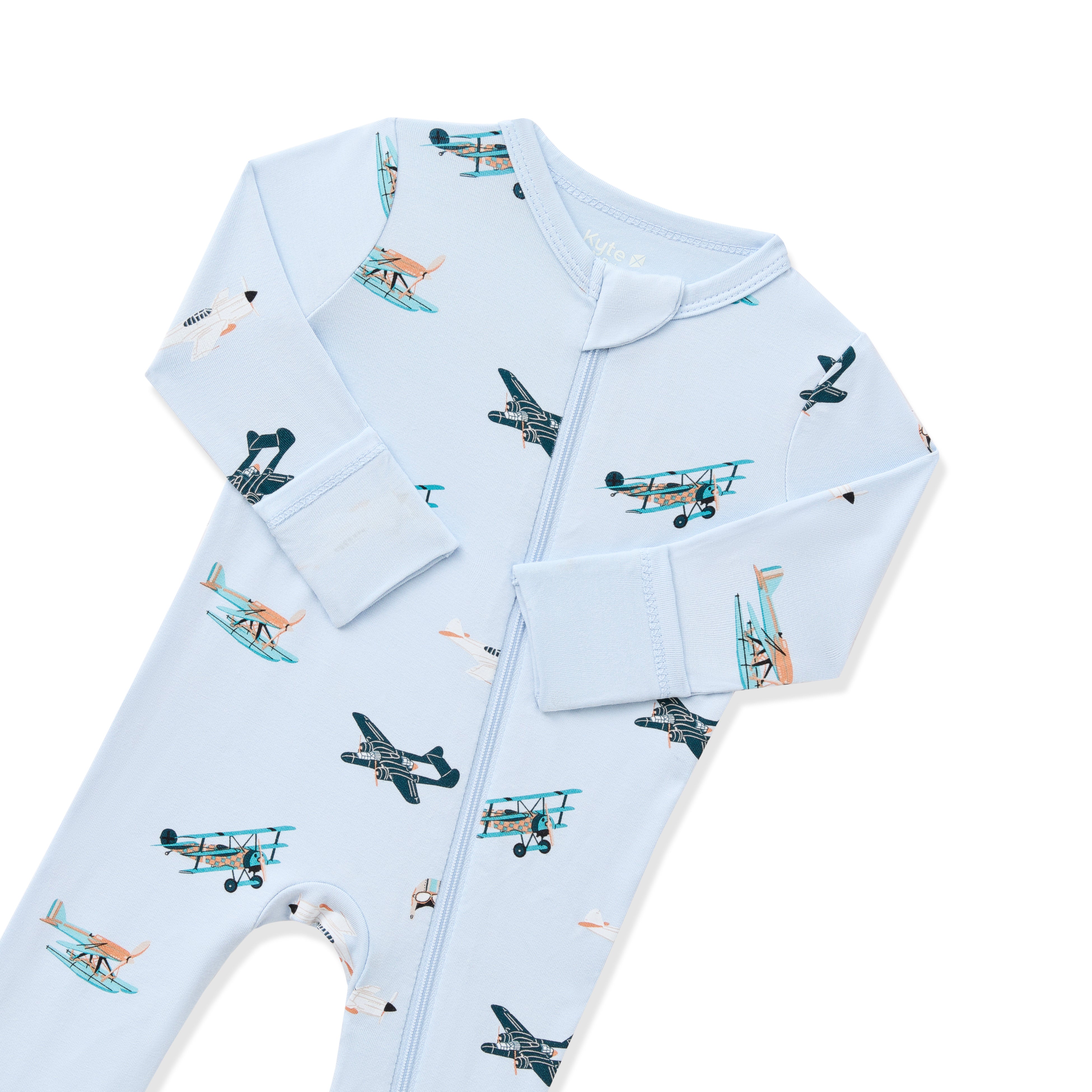 Close up of zipper garage and fold over hand cuffs on the Zippered Romper in Take Off