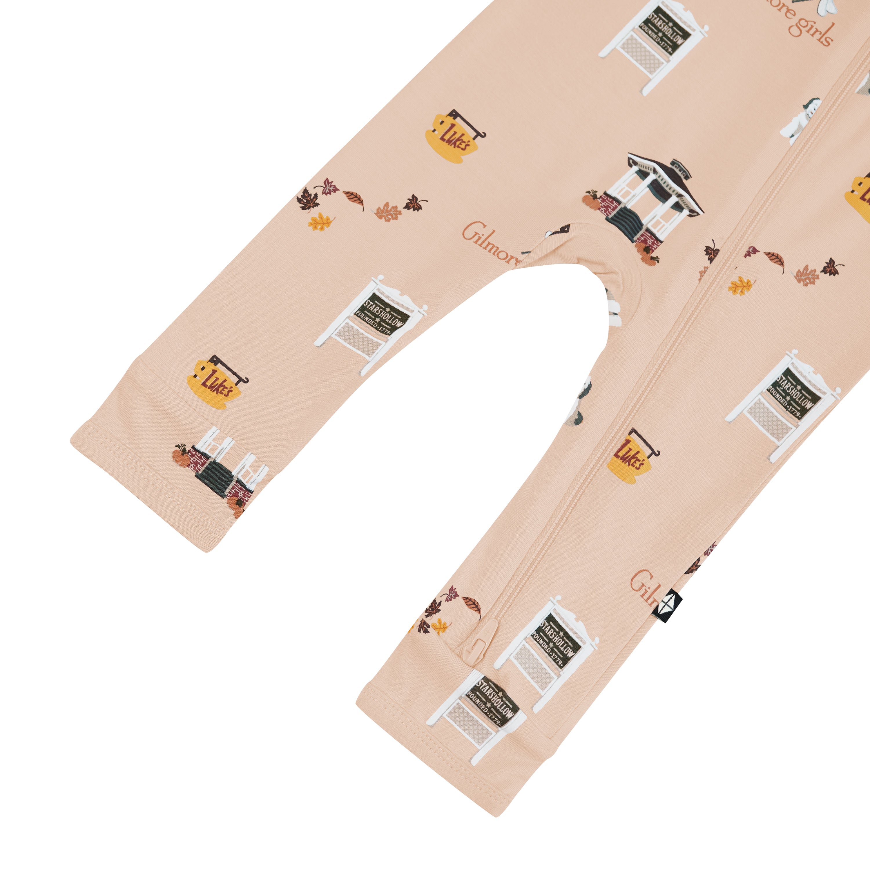 Beige romper with printed design of Gilmore Girls elements on a white background