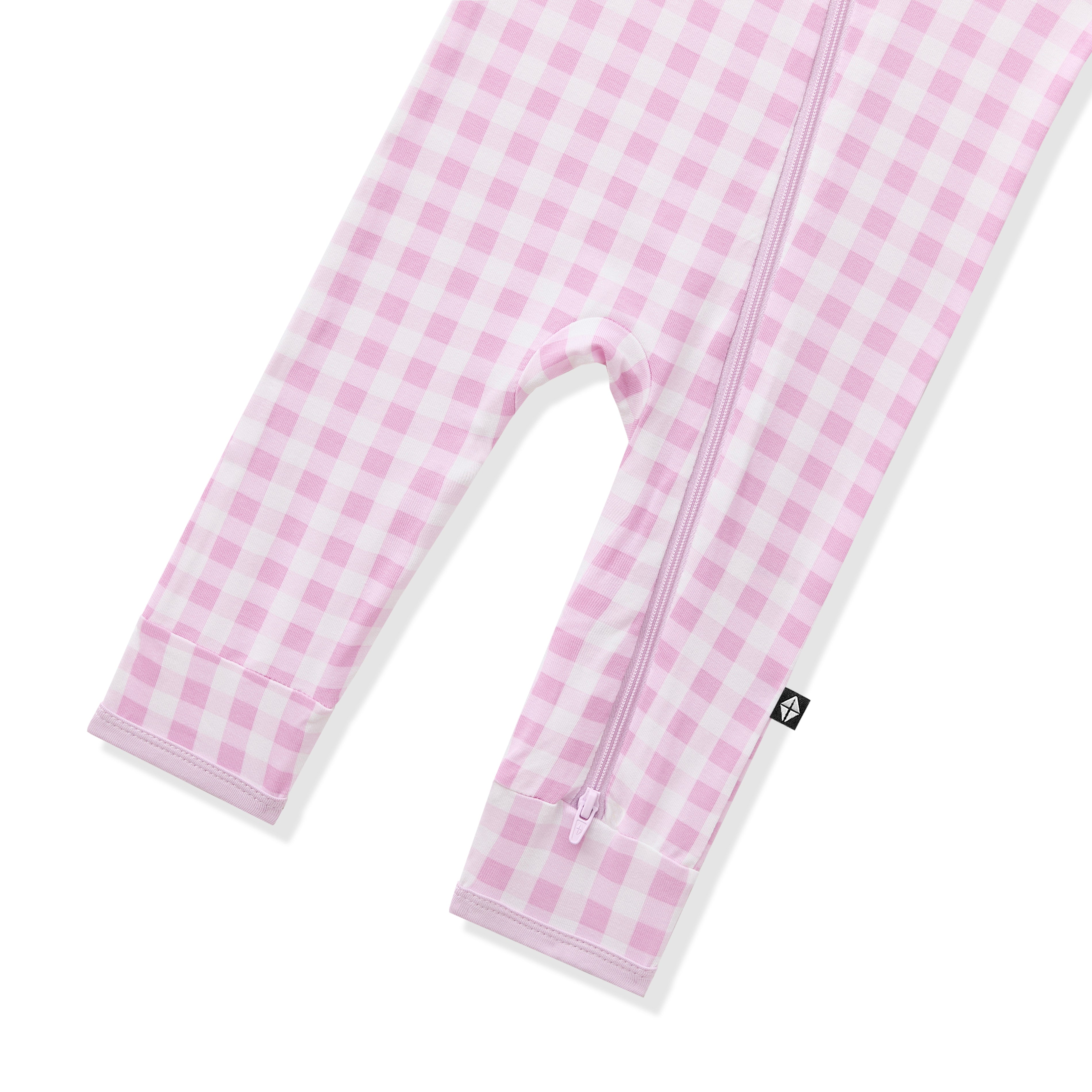 Zipper closure shown on the leg of the Zippered Romper in Gingham Thistle